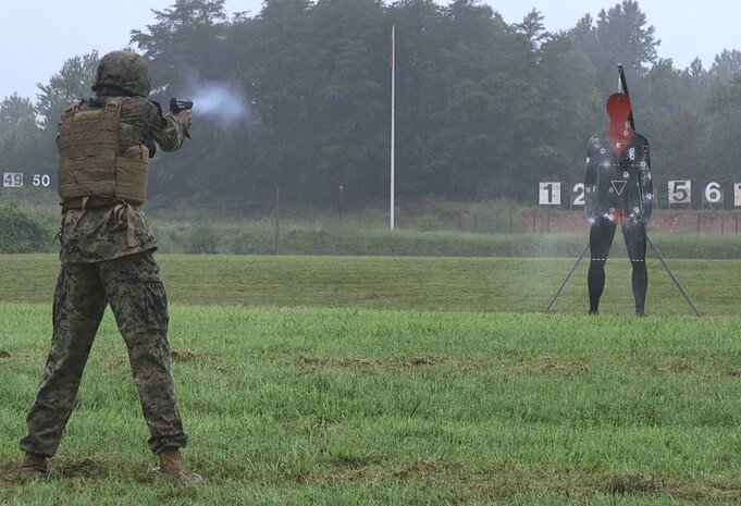 Firing a pepperball handgun.