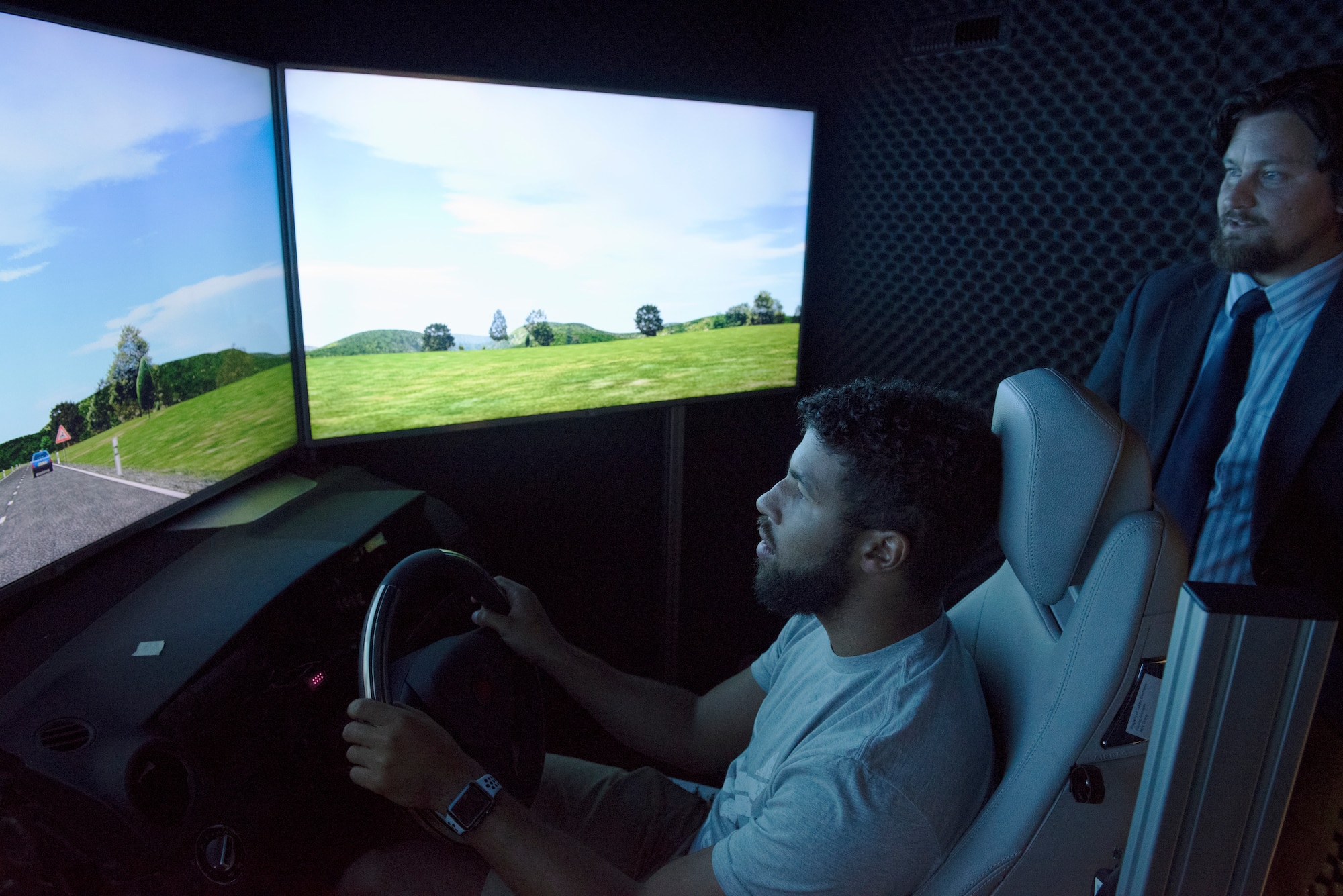 NASCAR driver Darrell “Bubba” Wallace Jr., test drives a simulated vehicle inside the biomedical research lab at the U.S. Air Force School of Aerospace Medicine, Wright-Patterson Air Force Base, Ohio, Sept. 7, 2018. The research is used for assessing aircrew fatigue and system performance. (U.S. Air Force photo by Michelle Gigante)
