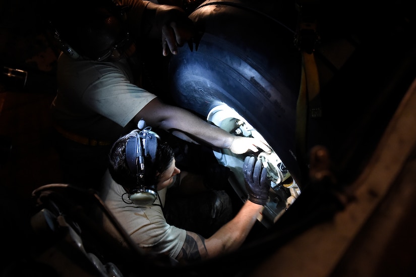 Staff Sgt. Coleman Younger, a 437th Aircraft Maintenance Squadron crew chief, performs a tire change on a C-17 Globemaster III Sept. 13, 2018, at Scott Air Force Base, Ill. 437 AMXS maintainers serviced more than 10 aircraft that were evacuated from Joint Base Charleston, S.C., to Scott AFB ahead of Hurricane Florence. In all, more than 20 C-17s and supporting personnel were evacuated to designated safe locations, enabling them to continue their global airlift operations.