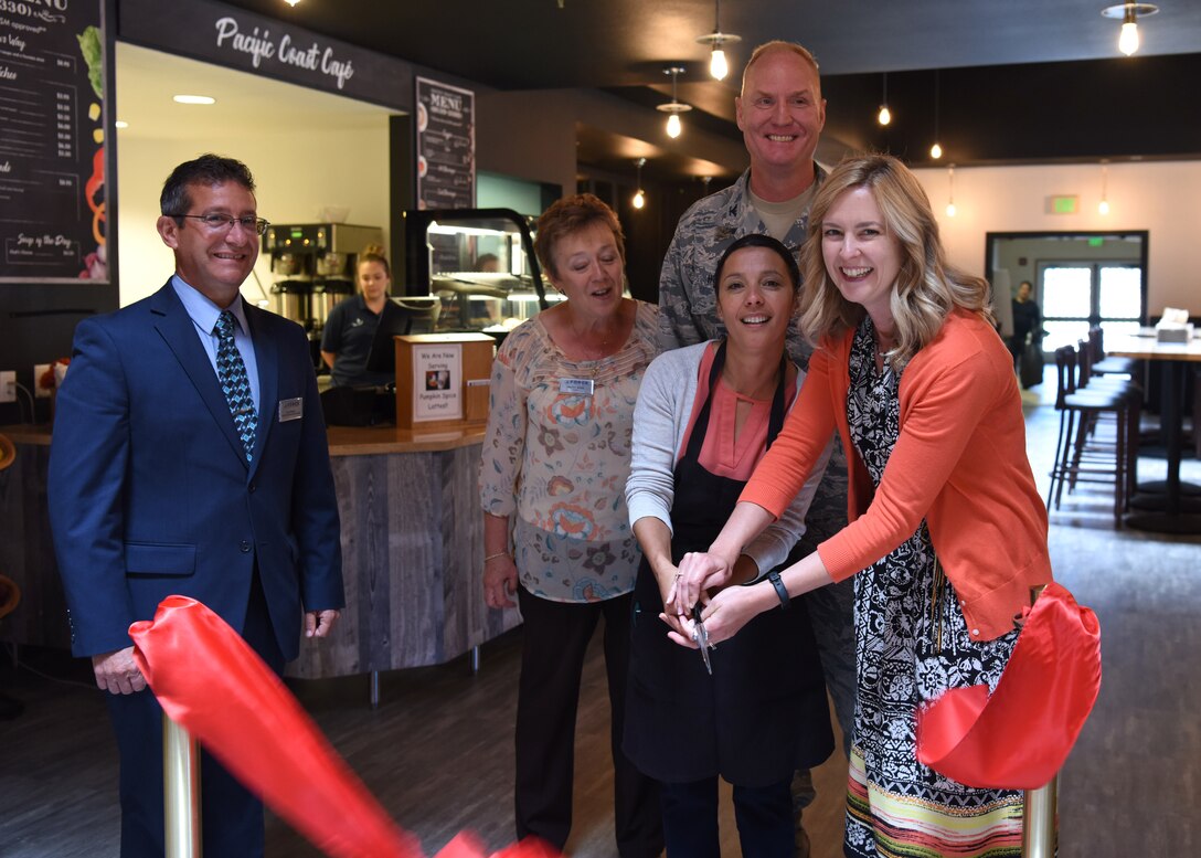 Col. Michael Hough, 30th Space Wing commander, and club management participate in a ribbon cutting for the Pacific Coast Café September 13, 2018 at the Pacific Coast Club at Vandenberg Air Force Base, Calif. (U.S. Air Force photo by Airman First Class Aubree Milks/Released)