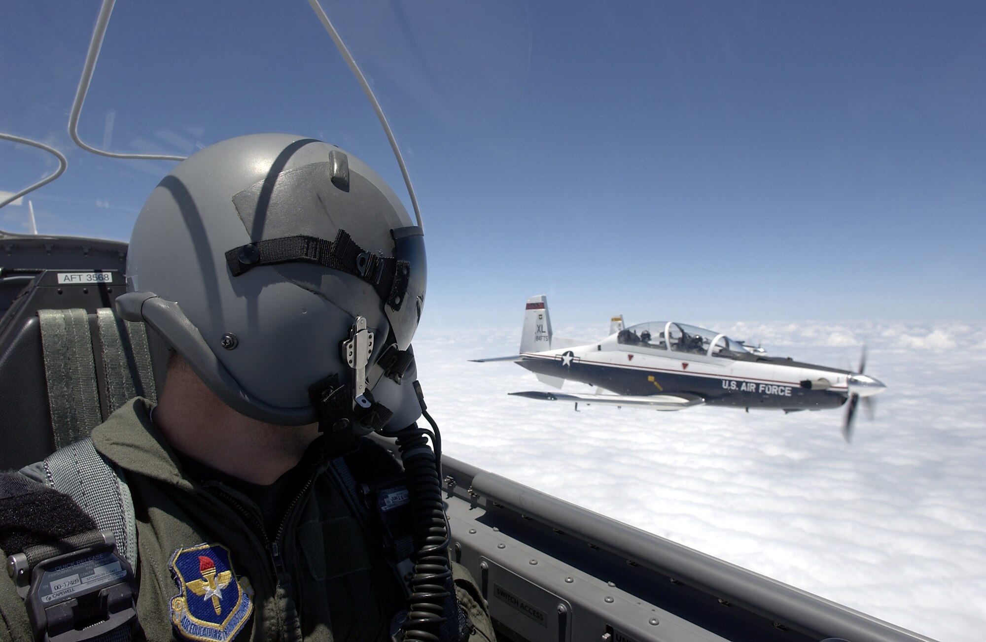 A T-6A Texan II pilot flies in formation with another T-6A over Laughlin Air Force Base, Texas.