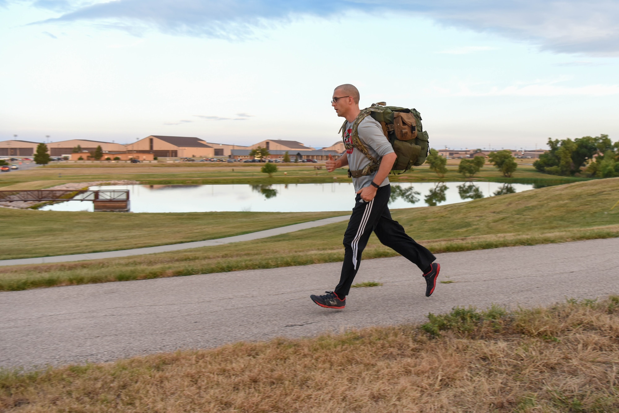 A service member participates in a Patriot Day 5K ruck march at Ellsworth Air Force Base, S.D., Sept. 11, 2018. Members of the 28th Force Support Squadron organized the event in remembrance of the nearly 3,000 people that died as result of the 9/11 terrorist attack. (U.S. Air Force photo by Airman Christina Bennett)