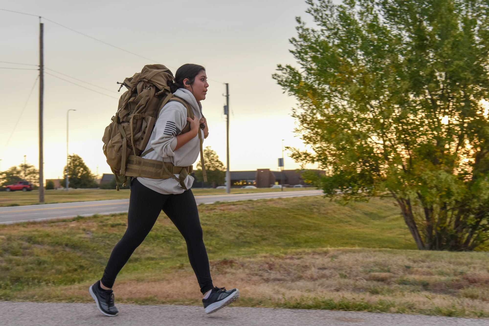 A 5K participant runs with a weighted rucksack in honor of Patriot Day at Ellsworth Air Force Base, S.D., Sept. 11, 2018.  The day marked the 17th anniversary of the 9/11 terrorist attack that claimed the lives of approximately 3,000 people and injured thousands of others. (U.S. Air Force photo by Airman Christina Bennett)