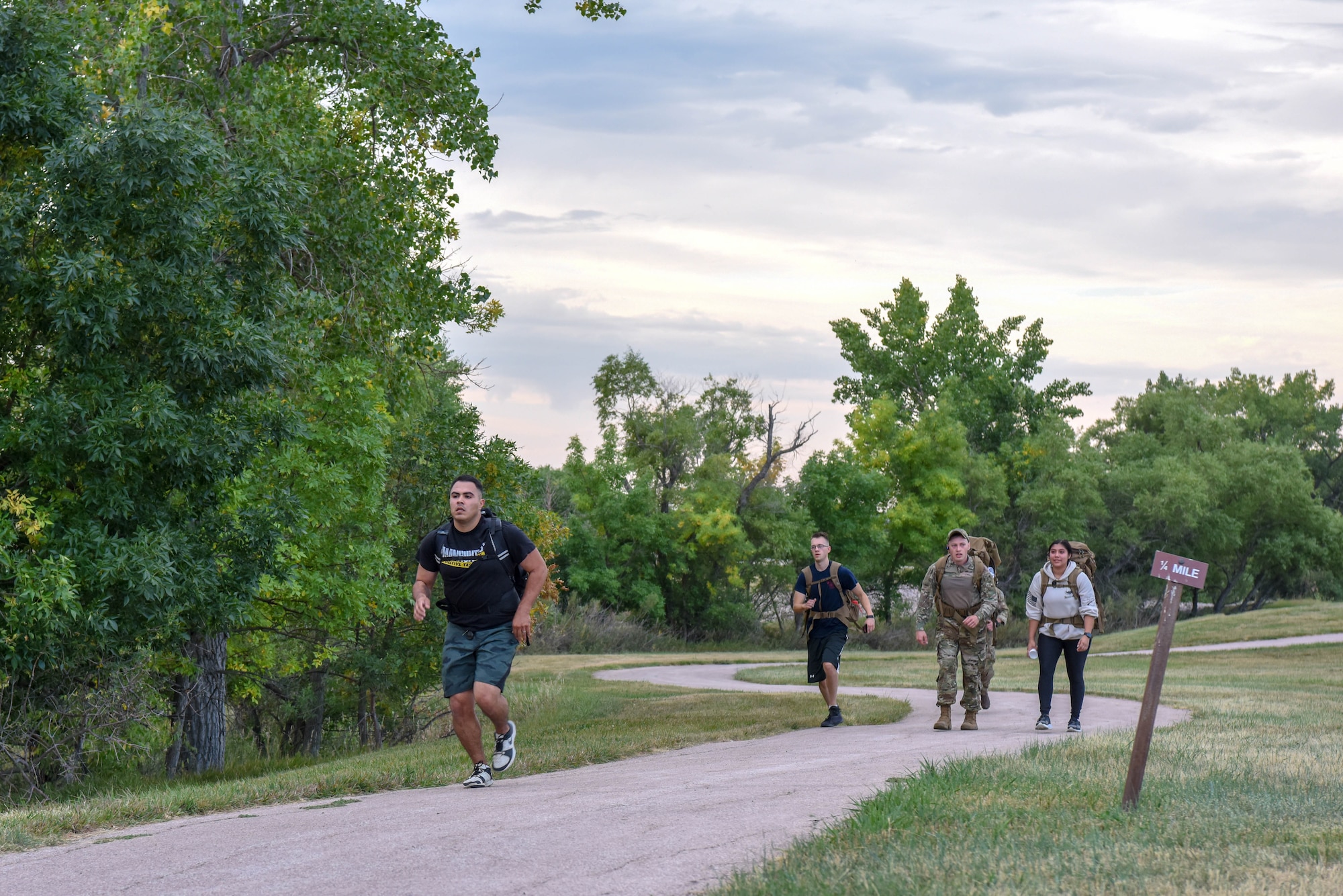 Service members participate in a 5K ruck march held in honor of Patriot Day at Ellsworth Air Force Base, S.D., Sept. 11, 2018. Approximately 35 men and women came together to ruck march on the 17th anniversary of the 9/11 terrorist attack that claimed the lives of nearly 3,000 people. (U.S. Air Force photo by Airman Christina Bennett)