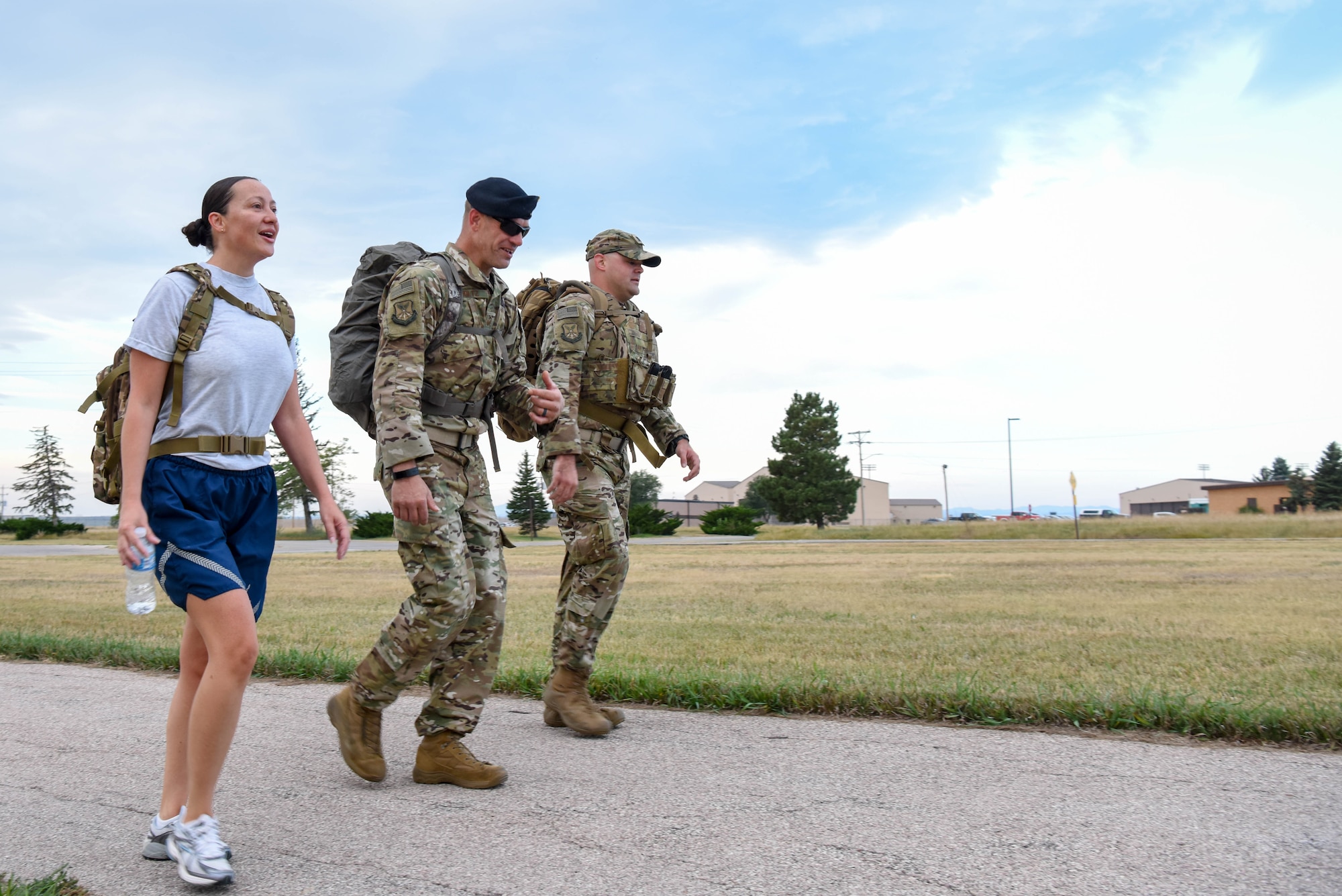 Service members participate in a 5K ruck march held in honor of Patriot Day at Ellsworth Air Force Base, S.D., Sept. 11, 2018. Participants gathered at the Heritage Lake pavilion on base prior to the ruck march to observe a moment of silence in remembrance of those who died as result of the 9/11 terrorist attack. (U.S. Air Force photo by Airman Christina Bennett)
