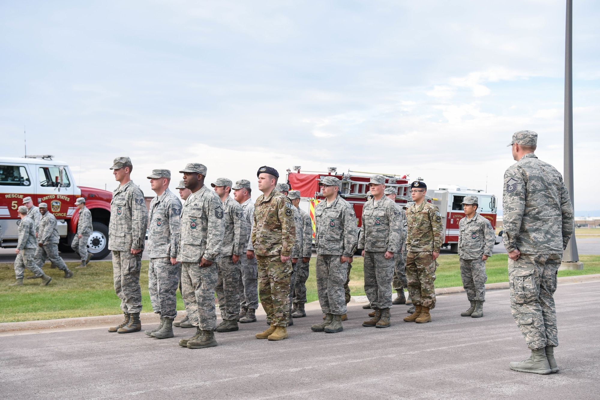Members of the 28th Civil Engineer Squadron fire department, emergency medical services and the 28th Security Forces Squadron form up at the 9/11 memorial ceremony outside of the 28th Bomb Wing headquarters at Ellsworth Air Force Base, S.D., Sept. 11, 2018. As a result of the 9/11 terrorist attack, 412 first responders died and countless others were injured while trying to save the lives of others. (U.S. Air Force photo by Airman Christina Bennett