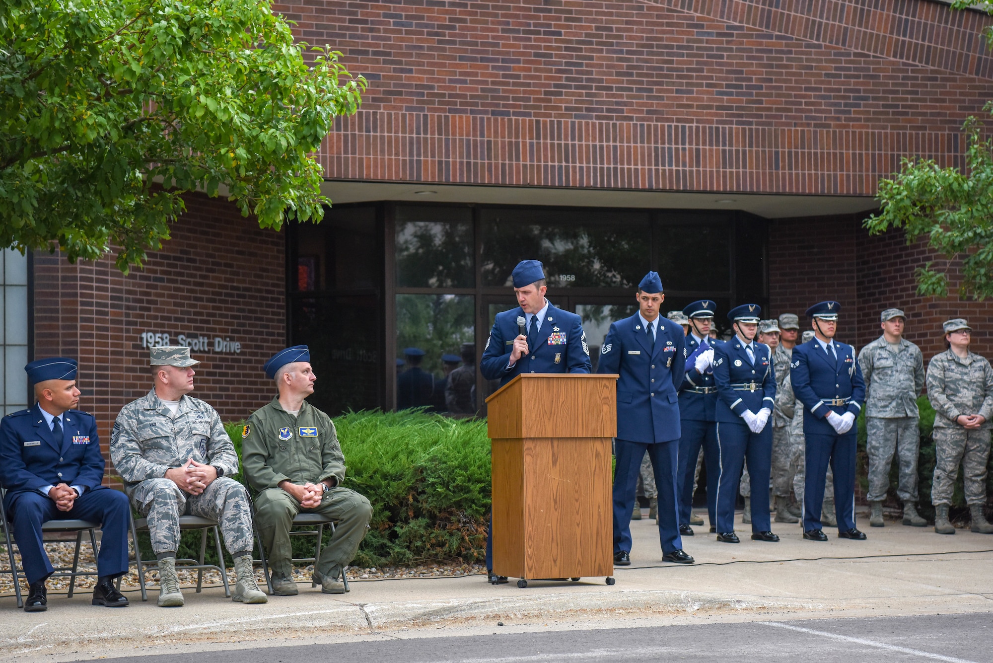 Senior Master Sgt. Zachary Townsend, the 28th Civil Engineer Squadron deputy fire chief, addresses the audience during a 9/11 memorial ceremony outside of the 28th Bomb Wing headquarters at Ellsworth Air Force Base, S.D., Sept. 11, 2018. The memorial ceremony was organized by the 28th CES Fire Department in honor of the nearly 3,000 people that died on Sept. 11, 2001. (U.S. Air Force photo by Airman Christina Bennett)