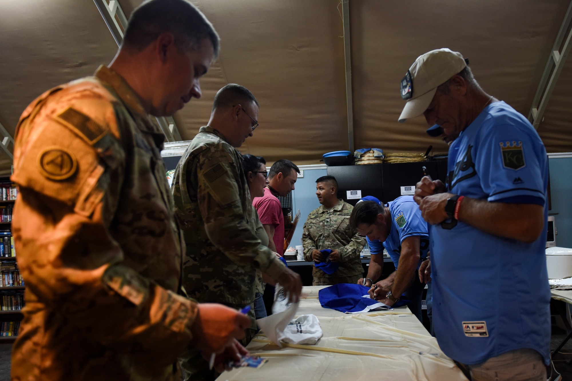 Members from the 35th Combat Aviation Brigade, meet with Kansas City Royals baseball legends during the USO tour “This one’s for you” Sept. 12, 2018, at Camp Buehring, Kuwait. Many of deployed men and women were part of the Missouri National Guard. (U.S. Air Force photo by Tech. Sgt. Caleb Pierce)