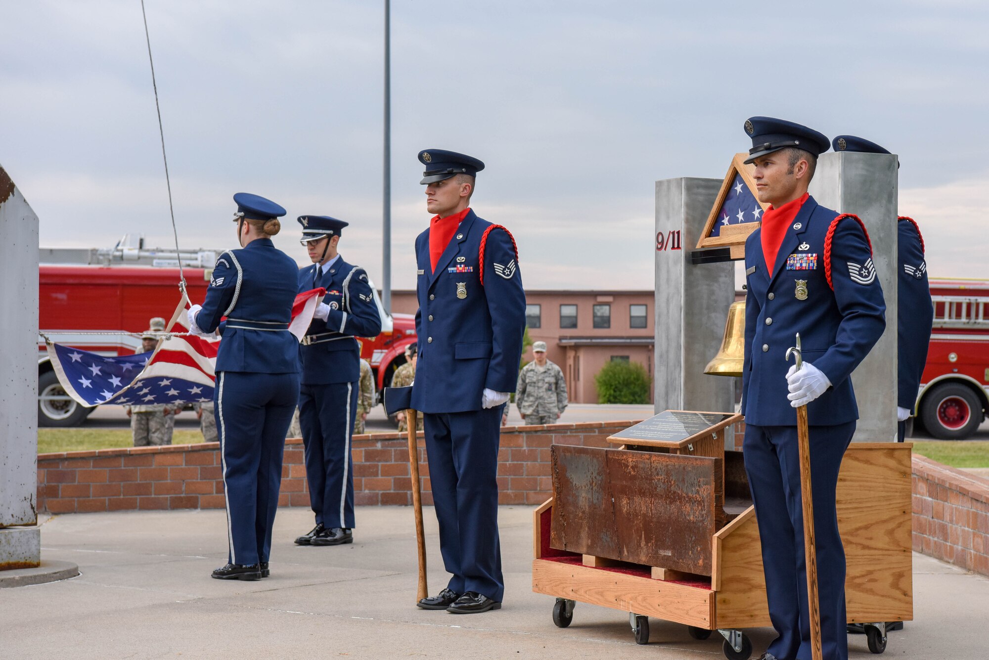 Members of the 28th Civil Engineer Squadron fire department rang the fire department bell at the 9/11 memorial ceremony outside of the 28th Bomb Wing headquarters at Ellsworth Air Force Base, S.D., Sept. 11, 2018. The bell was struck in three intervals of five rings, as firefighter tradition, in honor of the 343 firefighters that died on Sept. 11, 2001. (U.S. Air Force photo by Airman Christina Bennett)