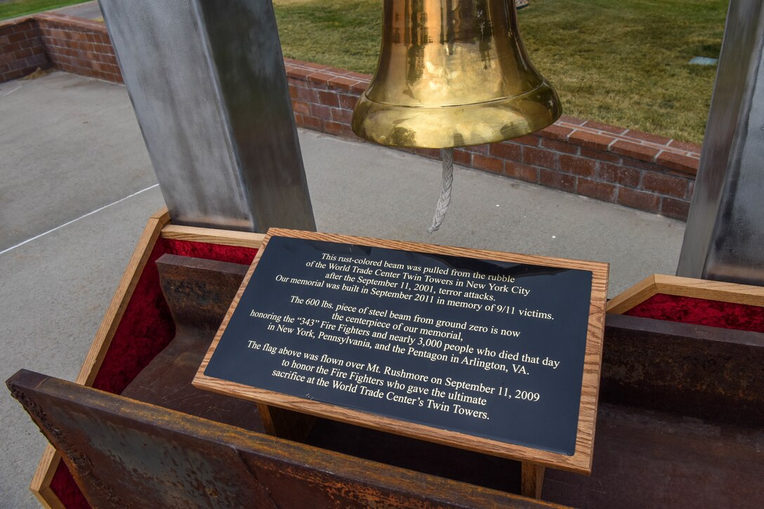 A portion of a steel beam collected from the wreckage of ground zero is displayed at the 9/11 memorial ceremony outside of the 28th Bomb Wing headquarters at Ellsworth Air Force Base, S.D., Sept. 11, 2018. The memorial ceremony was organized by the 28th Civil Engineer Squadron fire department in honor of the nearly 3,000 people that died on Sept. 11, 2001. (U.S. Air Force photo by Airman Christina Bennett)