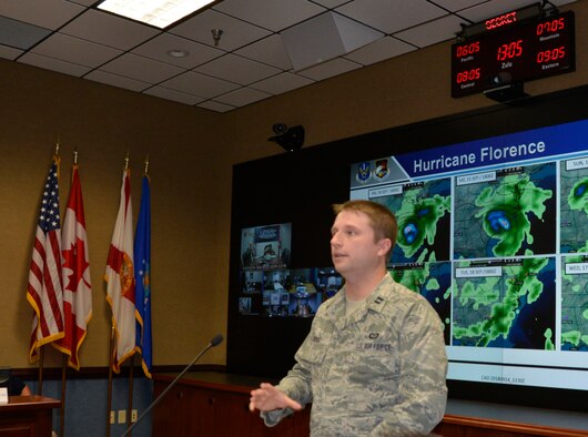 Capt. Leonard Mounsey, 601st Air Operations Center weather specialty team, describes the current forecast conditions related to Hurricane Florence during the Air Forces Northern morning commander’s update briefing Sept. 14. From providing specialized job personnel and equipment to assigning staging areas for supplies, AFNORTH, the air component of U.S. Northern Command, continues to assist that command’s support of the Federal Emergency Management Agency’s Hurricane Florence relief efforts. (Air Force photo by Mary McHale)