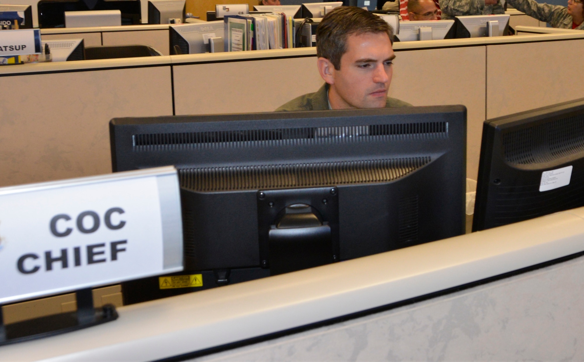 03.	Maj. Eric White, Air Forces Northern Contingency Action Team Current Operations Cell chief, reviews information pertaining to Hurricane Florence relief operations Sept. 14. From providing specialized job personnel and equipment to assigning staging areas for supplies, AFNORTH, the air component of U.S. Northern Command, continues to assist that command’s support of the Federal Emergency Management Agency’s Hurricane Florence relief efforts. (Air Force photo by Mary McHale)