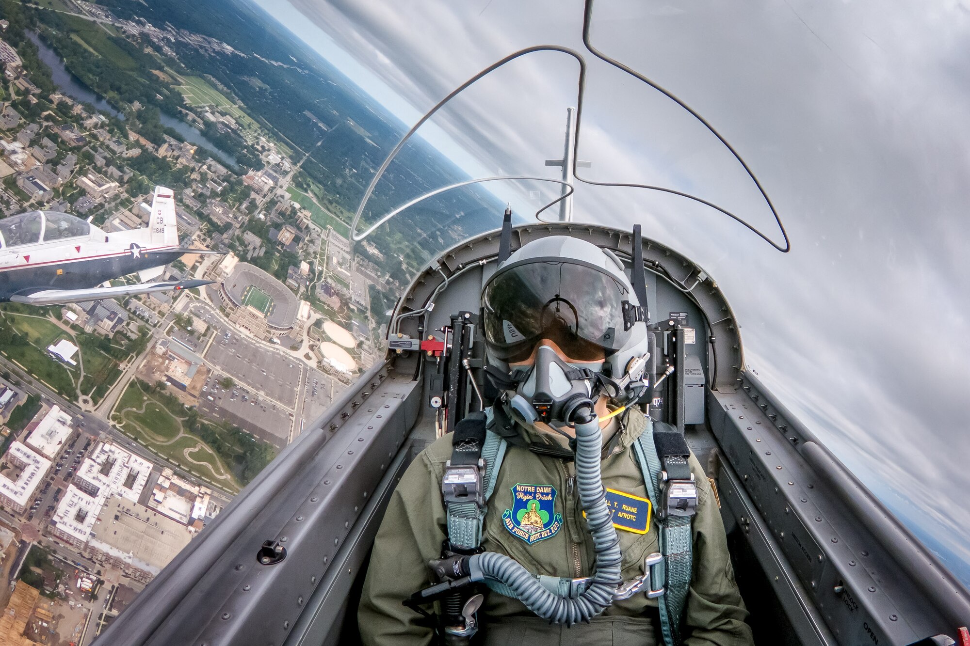 Notre Dame Air Force ROTC cadet Jill Ruane passes over campus as a backseater in a formation of two T-6 Texan IIs Sept. 9, 2018, in South Bend, Indiana. Several cadets from the Notre Dame Air Force ROTC program took familiarization flights in the T-6 the Sunday following the football game against Ball State. The aircraft belong to the 37th Flying Training Squadron who were on campus to perform the pregame flyover at the football game the previous day. (Photo by Matt Cashore/University of Notre Dame)