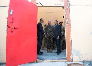 Marine Corps Gen. Joe Dunford, chairman of the Joint Chiefs of Staff, and U.S. Ambassador to Afghanistan John Bass await the arrival of Defense Secretary James N. Mattis at Resolute Support Headquarters in Kabul, Afghanistan.