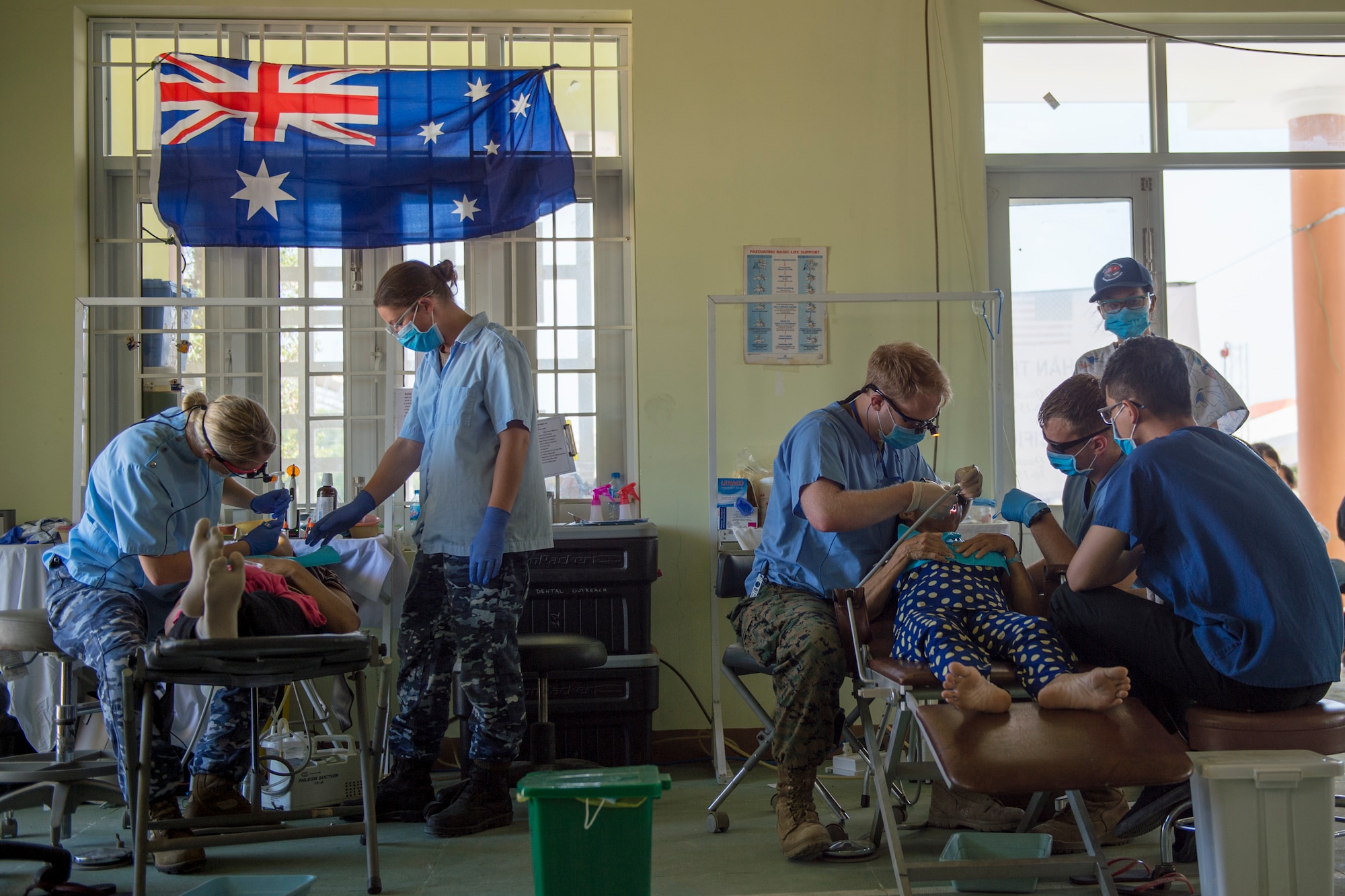 United States and Australian service members perform dental exams, cleanings and teeth extractions as part of Pacific Angel (PAC ANGEL) 18-2 at the Cultural House of Tam Giang commune in Nui Thanh, Quang Nam province, Vietnam, Sept. 12, 2018.