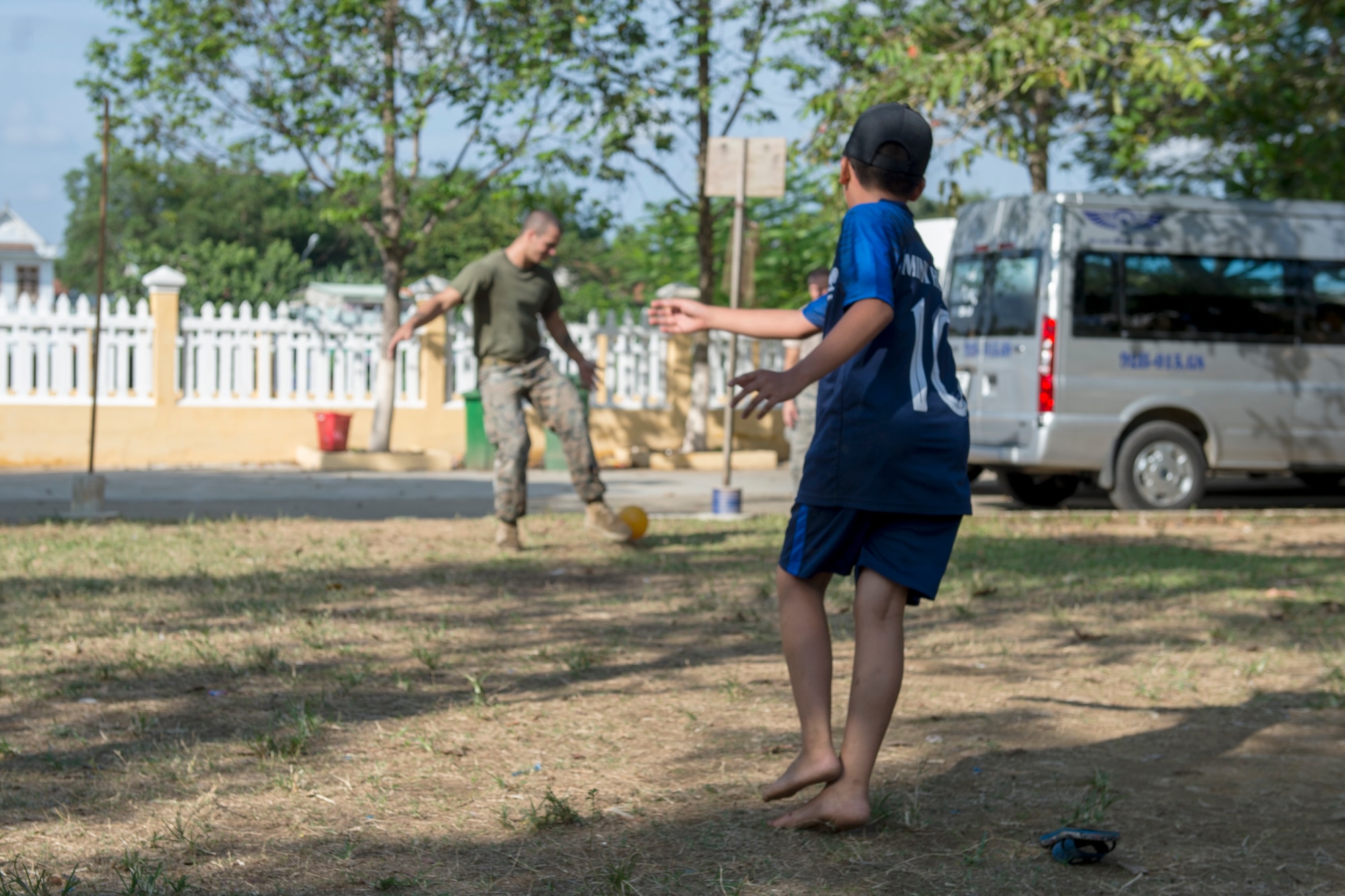 U.S. Marine Corps Cpl. David Ricketts, 7th Engineer Support Battalion combat engineer,  plays soccer with Tien Tho Primary School students during Pacific Angel (PAC ANGEL) 18-2 in Tien Tho commune, Tien Phuoc district, Vietnam, Sept. 10, 2018.