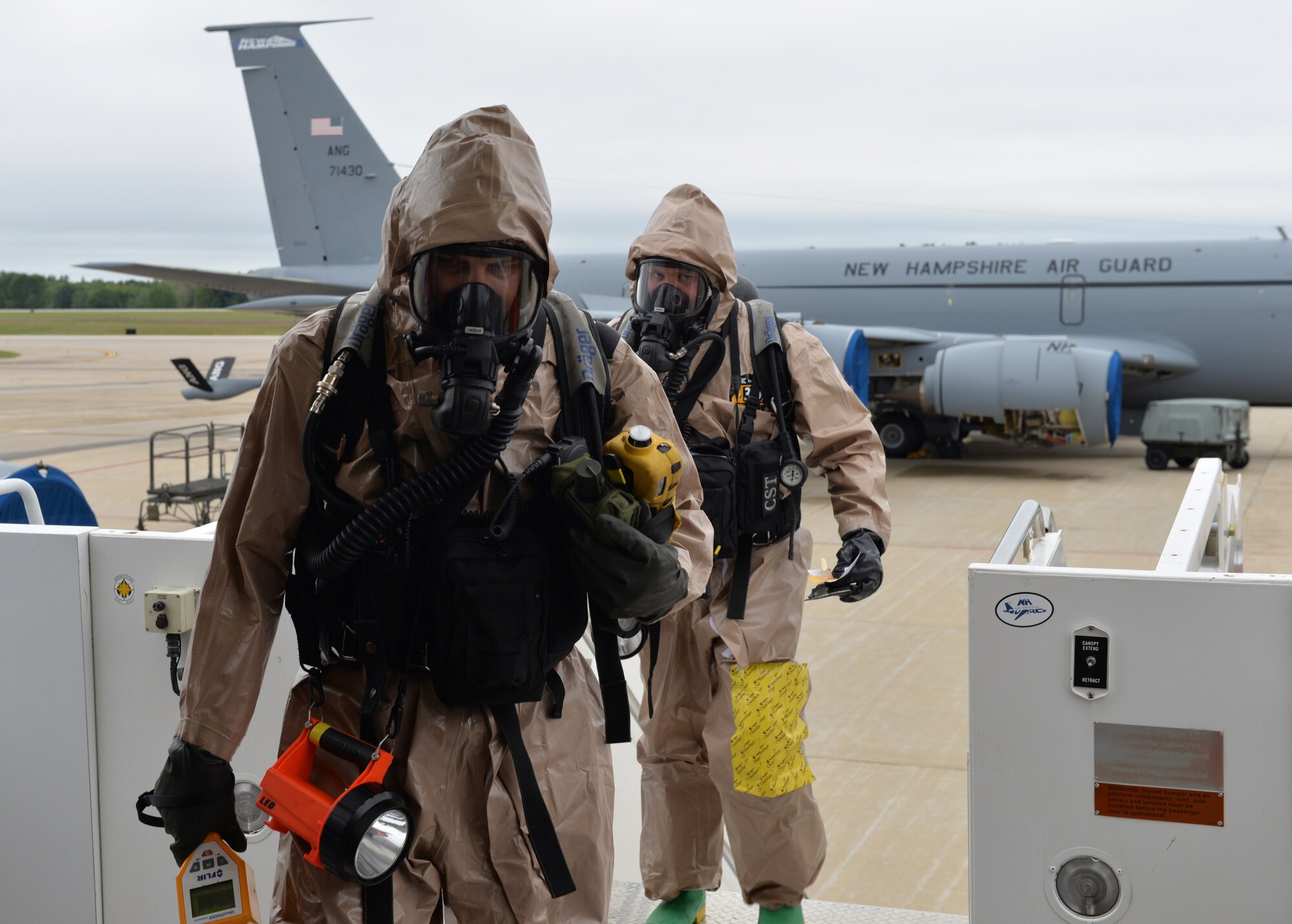 Sgt. David Fostier, Left, and Sgt. Taylor Hallett of the New Hampshire National Guard 12th Civil Support Team, enter a KC-135 Stratotanker to conduct a site survey, checking for hazardous substances during an evaluation Sept. 11, 2018, at Pease Air National Guard Base, N.H. The external evaluation was conducted by a team from U.S. Army North. The 12th CST includes 22 N.H. National Guard airmen and soldiers who are ready to mobilize within one hour. The team is designed to detect weapons of mass destruction, specializing in the detection of chemical, nuclear, biological and explosive agents. (Photo by Master Sgt. Thomas Johnson, 157th ARW Public Affairs)