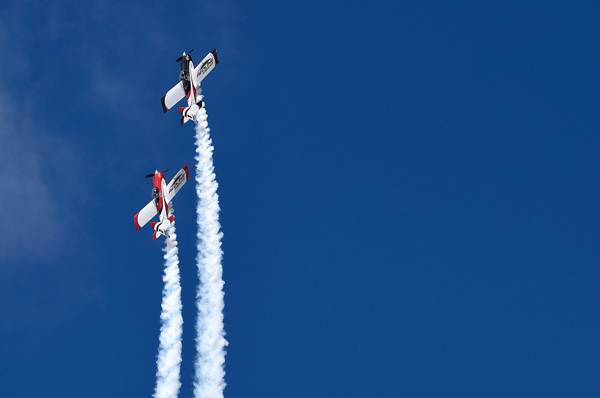 The Redline Air Shows team performs at the Frontiers in Flight Open House and Air Show Sept. 8, 2018, at McConnell Air Force Base, Kansas. The pilots have been flying together for more than 12 years. (U.S. Air Force photo by Airman 1st Class Michaela R. Slanchik)