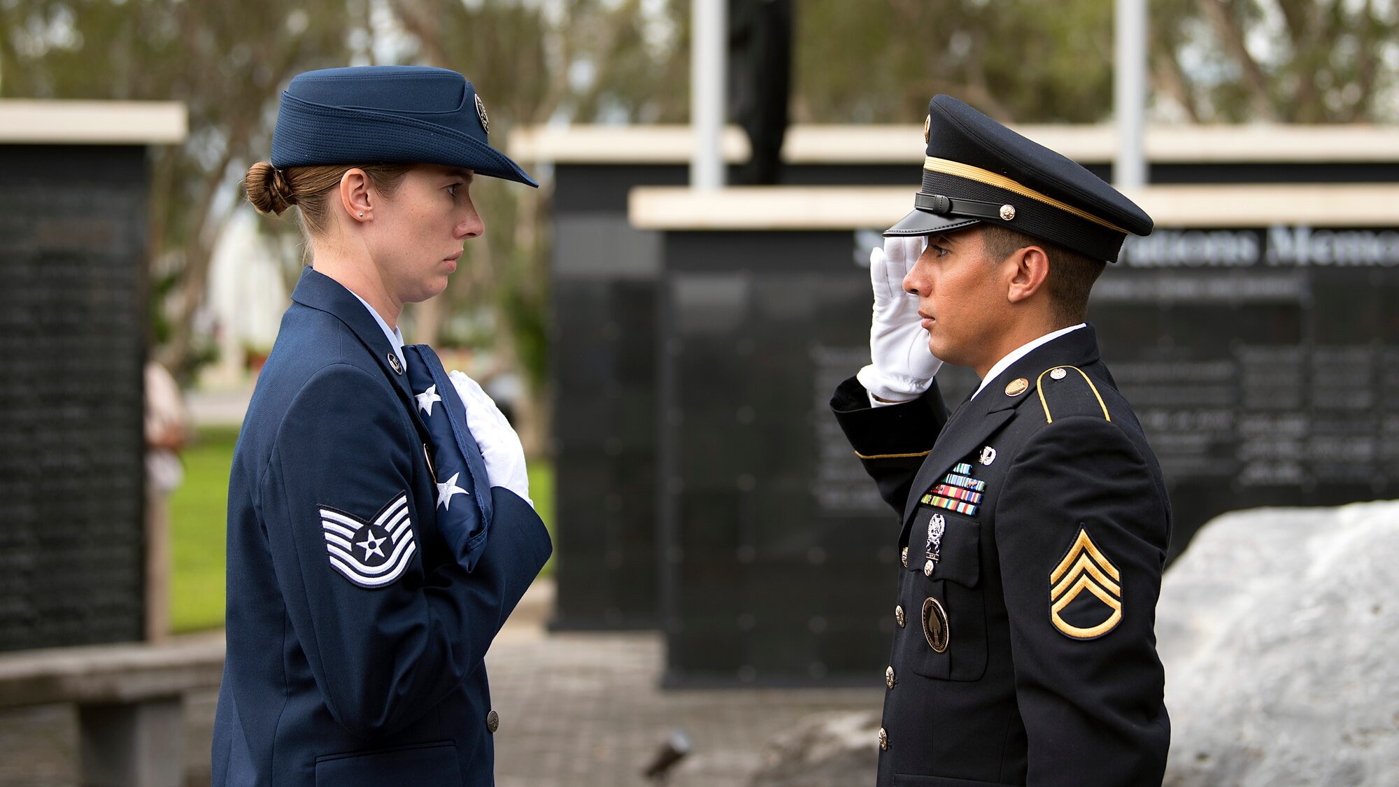 Service members from MacDill Air Force Base, Fla., complete a two-man flag fold during a 9/11 memorial ceremony Sept. 11, 2018. The remembrance ceremony was held at the U.S. Special Operations Command Memorial in honor of those who died during the attacks.
