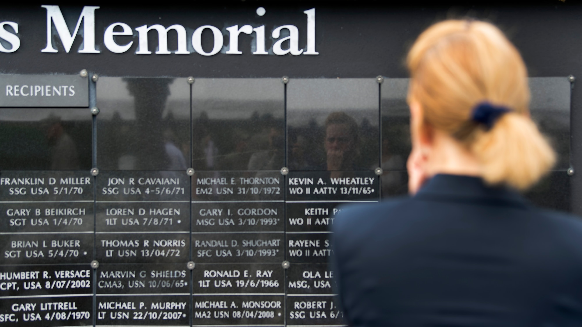 A Team MacDill Member pays respects to the names on the U.S. Special Operations Command Memorial after a 9/11 memorial ceremony held at MacDill Air Force Base, Fla., Sept. 11, 2018. The remembrance ceremony was held the in honor of those who died during the attacks.