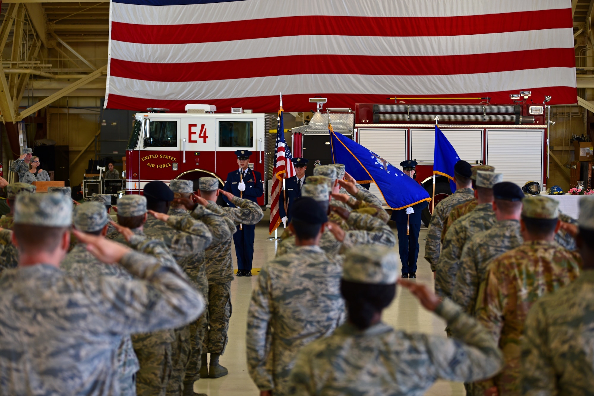 Airmen from the 325th Civil Engineer Squadron render a salute during the national anthem at a 9/11 remembrance ceremony at Tyndall Air Force Base, Fla., Sept. 11, 2018. The ceremony included a moment of silence followed by words from Col. Brian Laidlaw, 325th Fighter Wing commander, and Don Arias, 325th FW Public Affairs chief. (U.S. Air Force photo by Senior Airman Isaiah J. Soliz)
