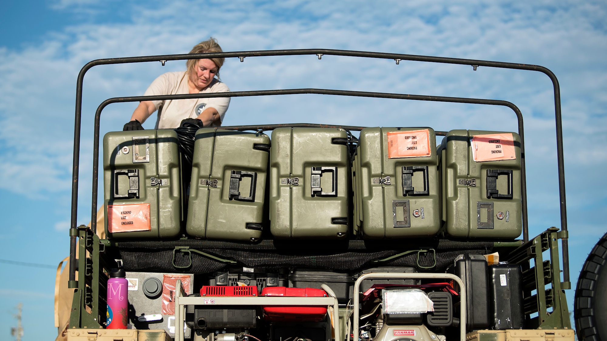 An En-Route Patient Staging System team member finishes loading equipment onto a Humvee Sept. 13, 2018, in preparation of Hurricane Florence. The ERPSS team’s mission is to provide clinical support to patients in response to a natural disaster.  (U.S. Air Force photo by Airman 1st Class Caleb Nunez)