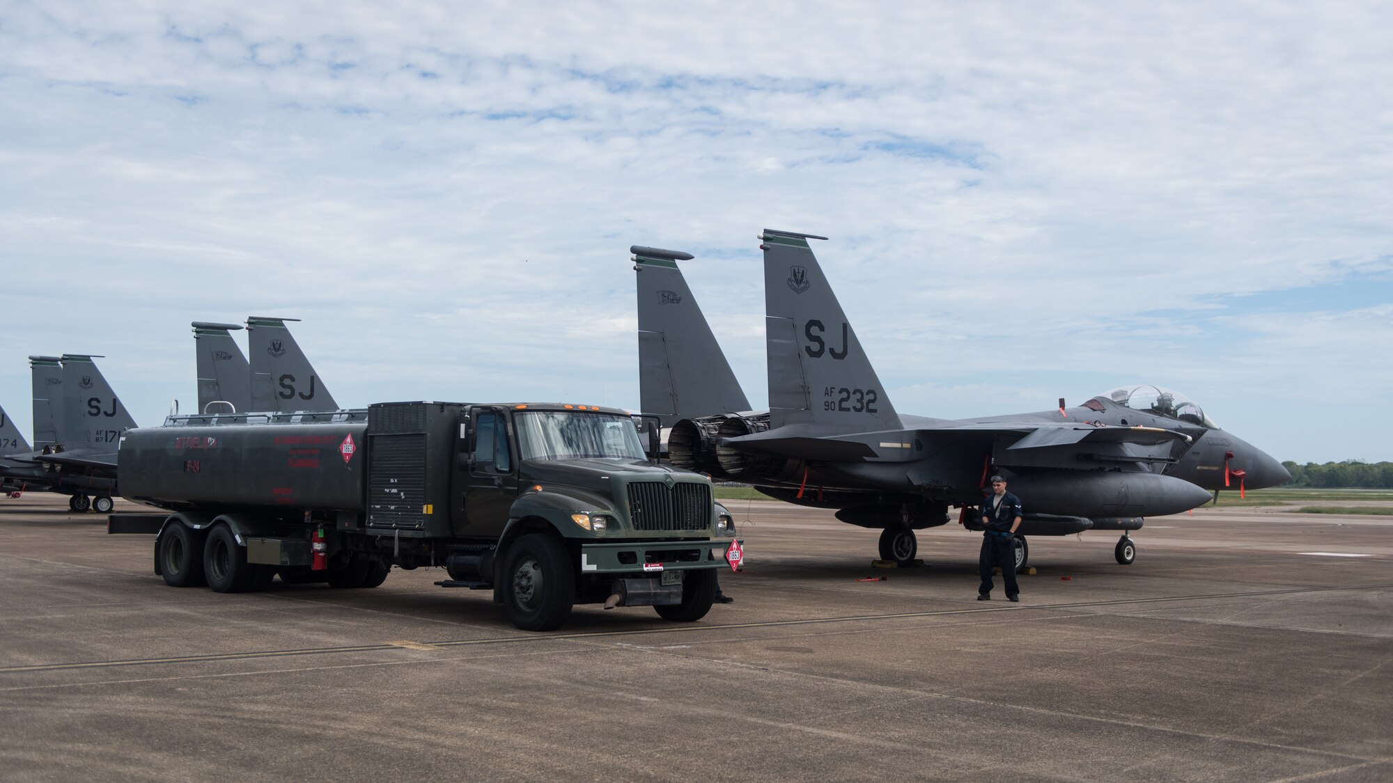 Airmen from the 2nd Logistic Readiness Squadron petroleum, oils and lubricants distribution flight prepare to fuel F-15E Strike Eagles from Seymour Johnson Air Force Base, North Carolina at Barksdale Air Force Base, La., Sept. 12, 2018. The aircraft evacuated to Barksdale to avoid possible damage from Hurricane Florence