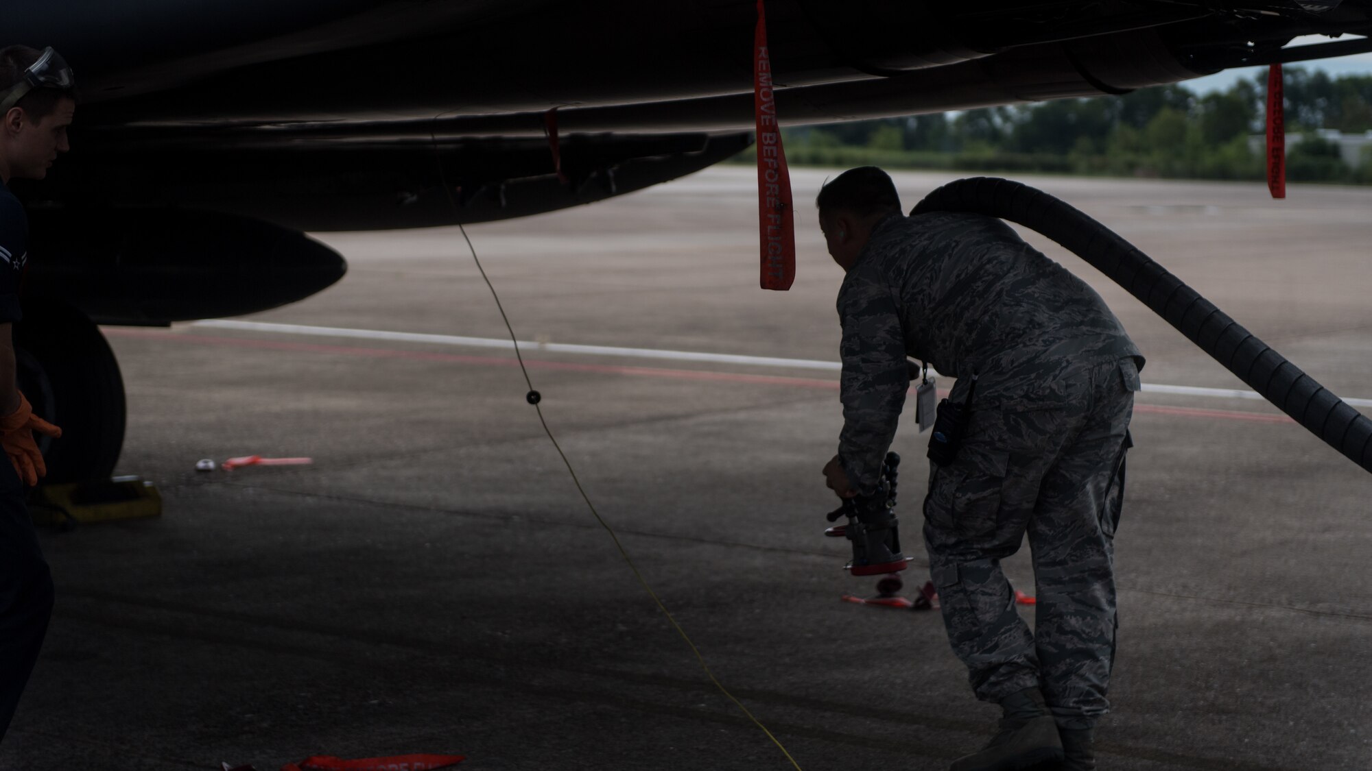 An Airman from the 2nd Logistic Readiness Squadron petroleum, oils and lubricants distribution flight prepare to fuel F-15E Strike Eagles from Seymour Johnson Air Force Base, North Carolina at Barksdale Air Force Base, La., Sept. 12, 2018. The aircraft evacuated to Barksdale to avoid possible damage from Hurricane Florence.
