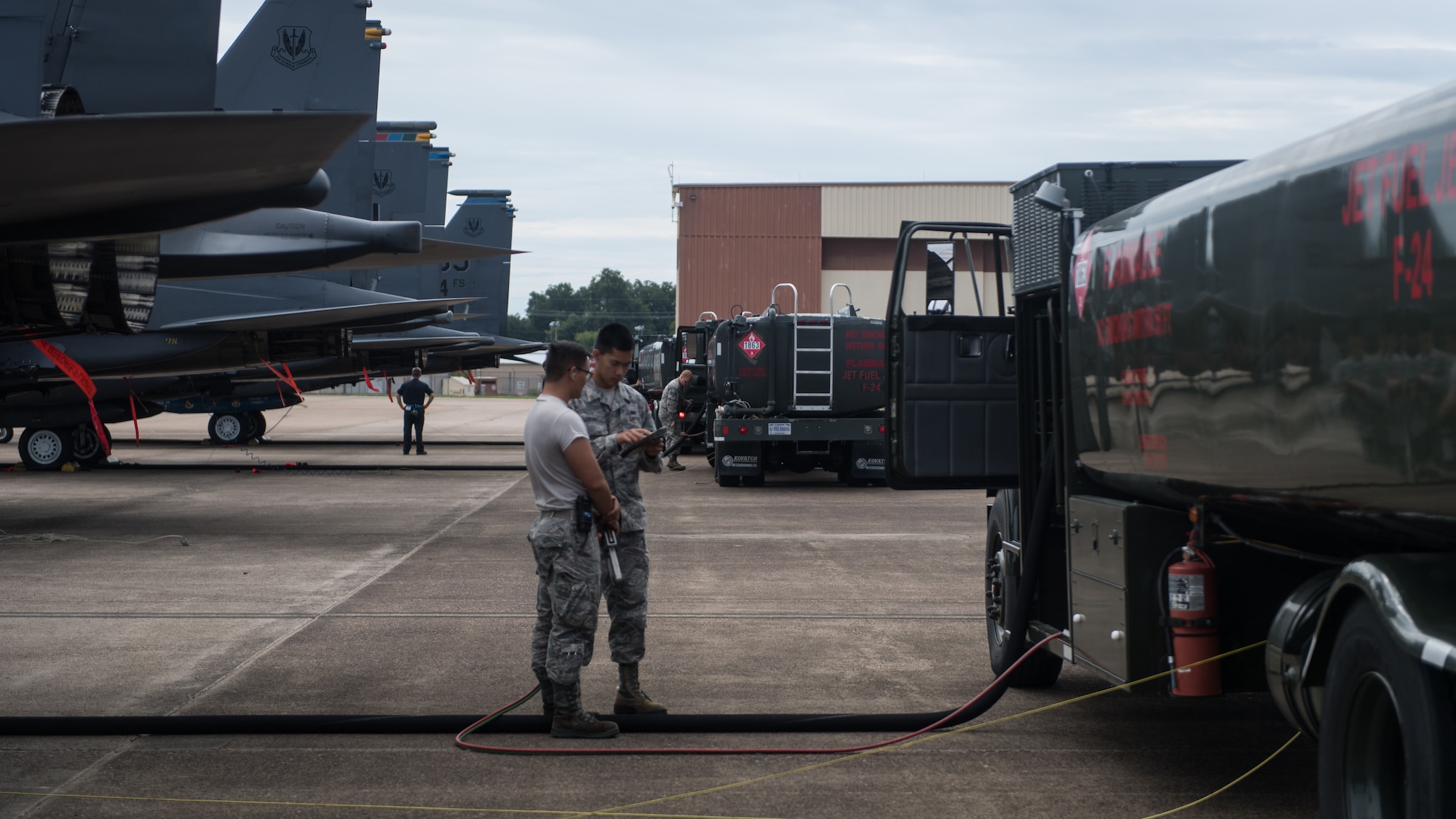 Airmen from the 2nd Logistic Readiness Squadron petroleum, oils and lubricants distribution flight prepare to fuel F-15E Strike Eagles from Seymour Johnson Air Force Base, North Carolina at Barksdale Air Force Base, La., Sept. 12, 2018. The aircraft evacuated to Barksdale to avoid possible damage from Hurricane Florence.