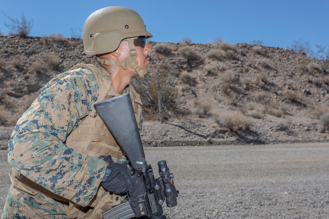 Cpl. Tilford Black, Organization Automotive Mechanic, is at the low-ready awaiting the command to engage his target during weapons qualification aboard Marine Corps Logistics Base Barstow, California, Sept. 13. (U.S. Marine Corps photo by Jack J. Adamyk)