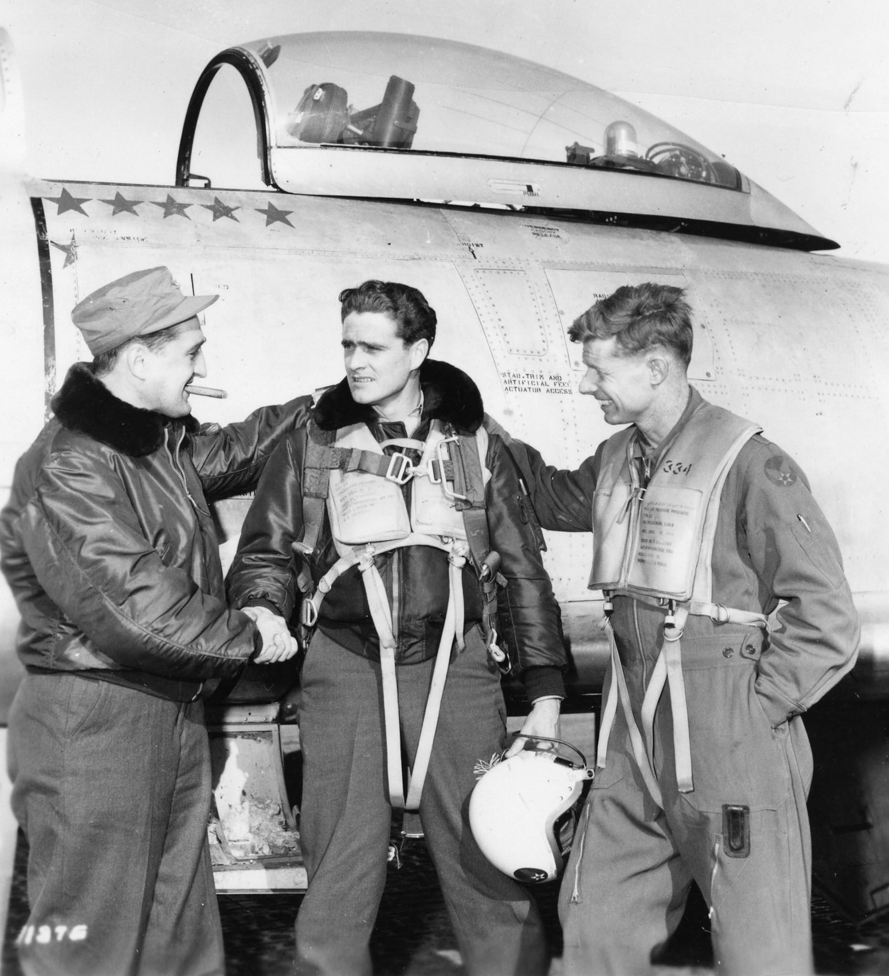 Francis S. Gabreski (left) congratulates another World War II and Korean War ace, Maj. William T. Whisner (center). On the right is Lt. Col. George Jones, a MiG ace with 6.5 kills. (U.S. Air Force photo)