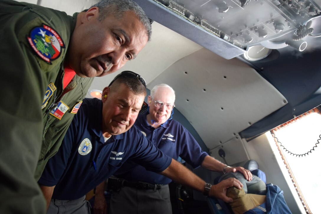 U.S. Air Force Tech. Sgt. Robert Reyes, 433rd Aircraft Maintenance Squadron aircraft engine mechanic, shows controls on a C-5M Super Galaxy aircraft to Civil Air Patrol senior members at Joint Base San Antonio-Lackland, Texas, Sept. 8, 2018