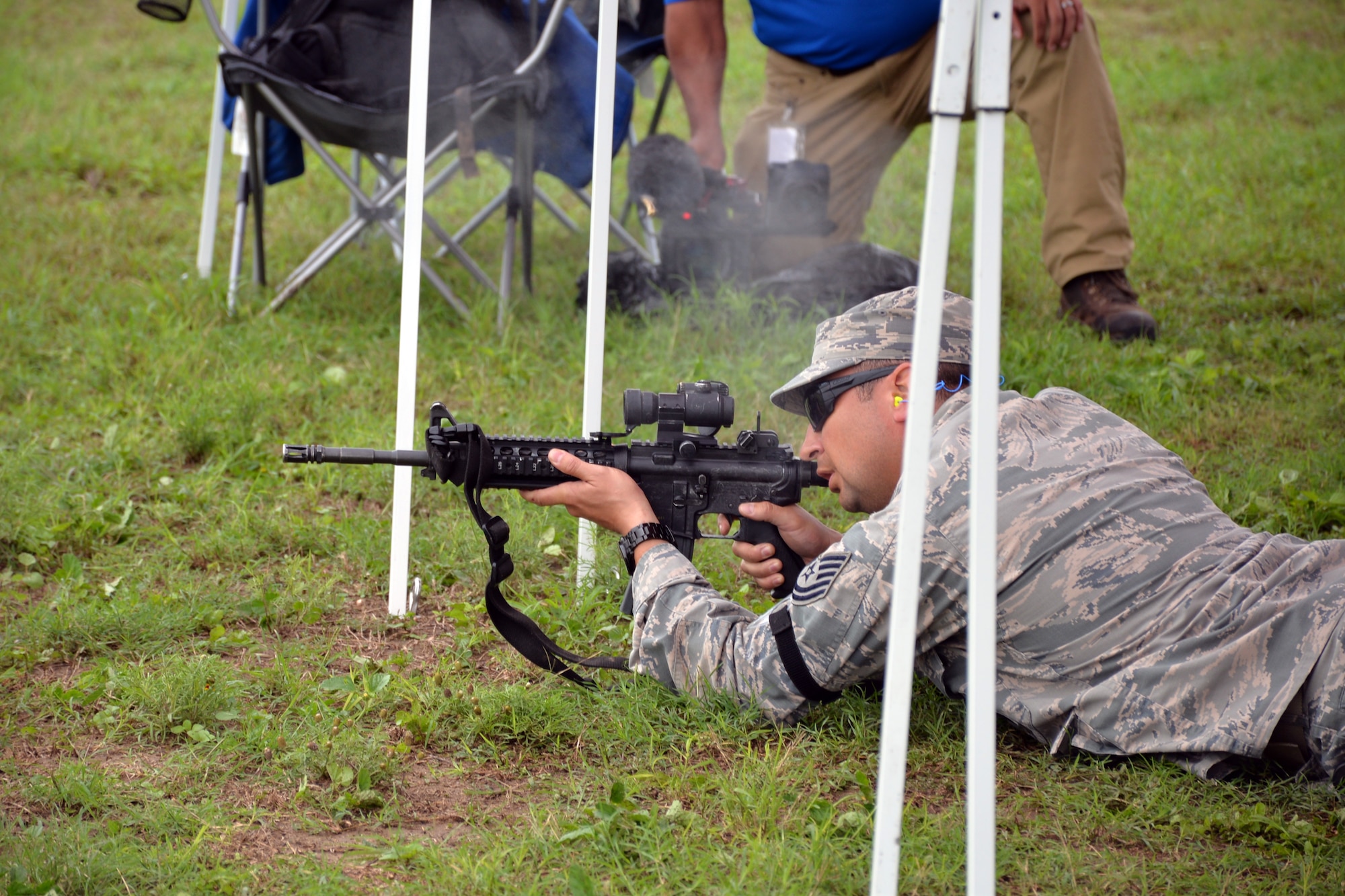 Tech Sgt. Francisco Gonzalez, Air Force Reserve Command Defender Challenge team member, fires an M4 carbine rifle at the Brain in a Box during the combat endurance relay Sept. 13, 2018 at Camp Bullis Military Training Reservation, Texas.