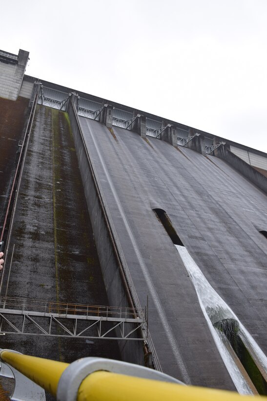 View Detroit Dam from below. Detroit is a concrete dam with gated spillways. It was completed in 1953 and is 463 feet tall.