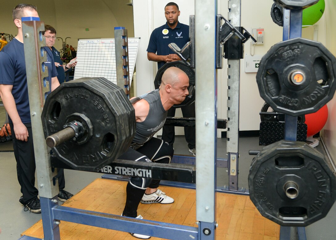 Compeitive powerlifter Chris Valentino competes in the squat portion of a powerlifting competition at the Rosburg Fitness Center on Edwards Air Force Base, California, Sept. 13, 2018. (U.S. Air Force photo by Giancarlo Casem