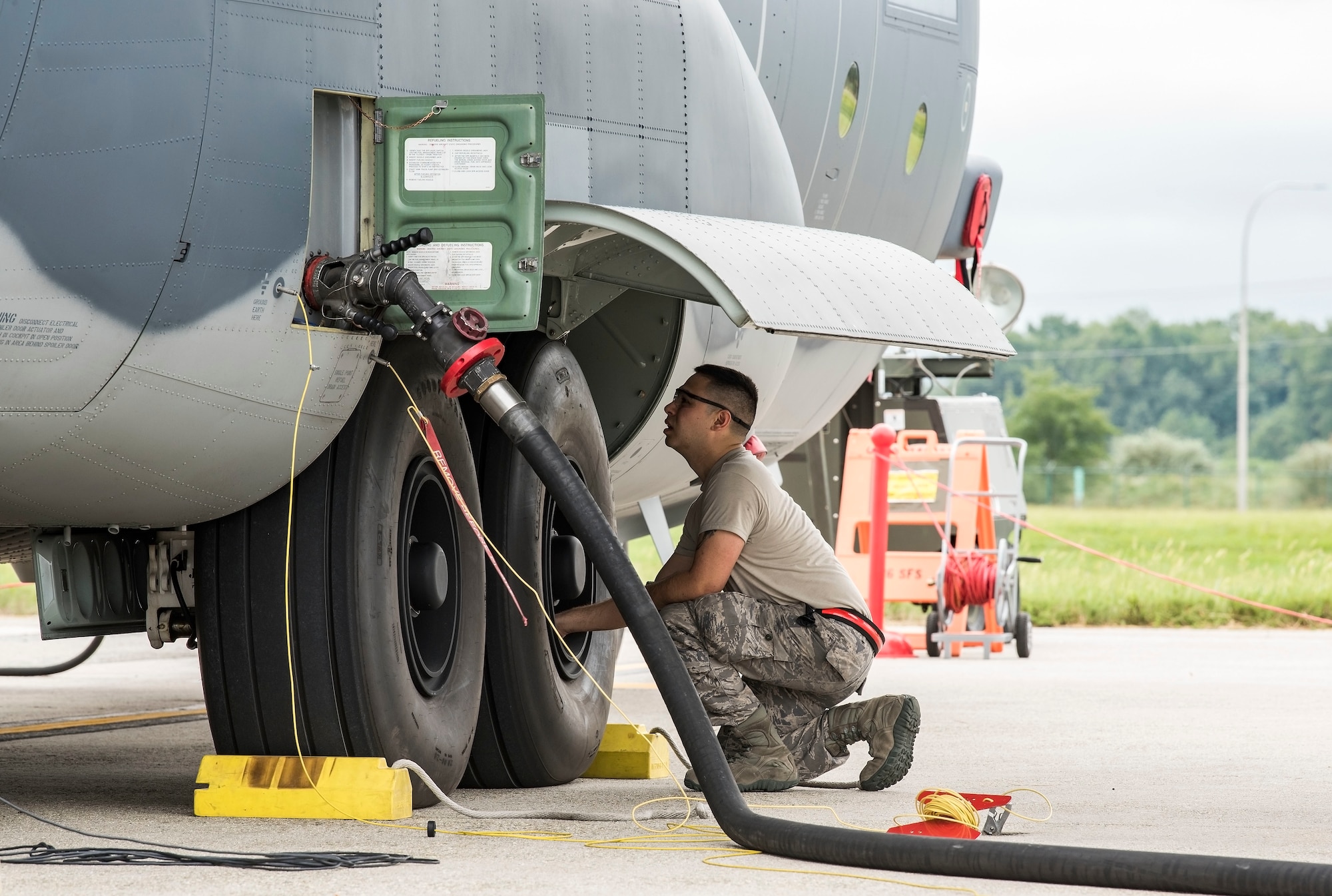 An Alaska Air National Guard aircraft maintainer from the 176th Wing, Joint Base Elmendorf-Richardson, Alaska,   inspects the main landing gear tires of a HC-130J Sept. 13, 2018, at Dover Air Force Base, Del. Members and equipment from the 176th Wing, 176th Aircraft Maintenance Squadron, 211th and 212th Rescue Squadrons at JBER arrived at Dover on Sept. 12 to support hurricane relief efforts when called upon. (U.S. Air Force photo by Roland Balik)