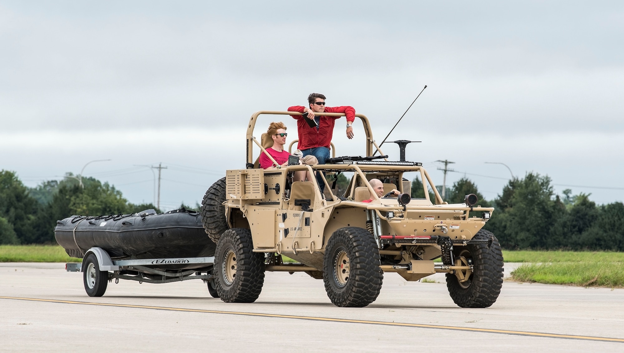 Alaska Air National Guard Master Sgt. Cody Inman, 212th Rescue Squadron pararescue team leader, Joint Base Elmendorf-Richardson, Alaska, rides on top of a Guardian Angel Air-droppable Rescue Vehicle headed to a HC-130J Sept. 13, 2018, at Dover Air Force Base, Del. Members and equipment from the 176th Wing, 176th Aircraft Maintenance Squadron, 211th and 212th Rescue Squadrons at JBER arrived at Dover on Sept. 12 to support hurricane relief efforts when called upon. (U.S. Air Force photo by Roland Balik)