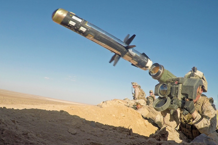 A Marine shoulder-fires an anti-tank missile.