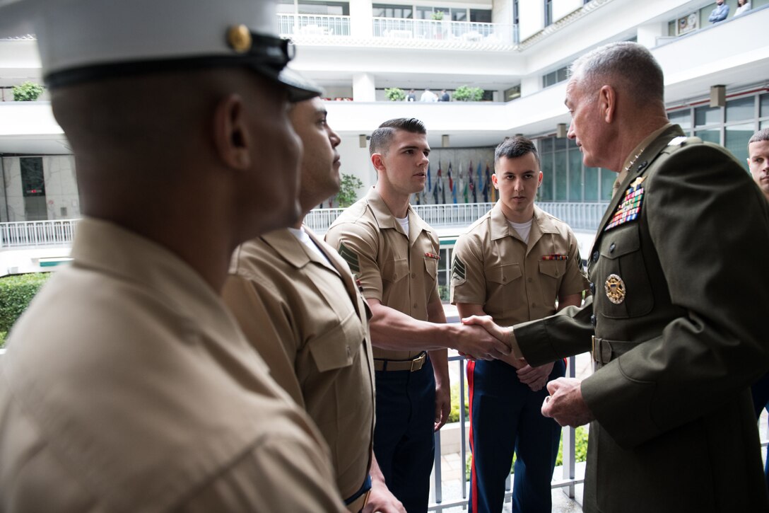 Marine Corps Gen. Joe Dunford, chairman of the Joint Chiefs of Staff, meets with Marine security guards.
