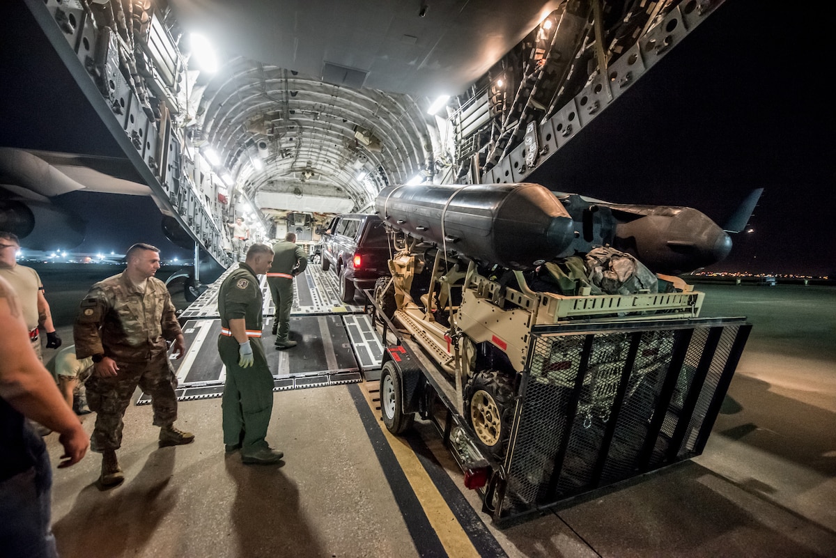 Airmen from the 123rd Airlift Wing load vehicles and cargo onto a C-17 Globemaster III aircraft at the Kentucky Air National Guard Base in Louisville, Ky., Sept. 15, 2018 in response to Tropical Storm Florence. The gear and 10 Airmen from the 123rd Special Tactics Squadron are being deployed to Naval Air Station Oceana in Virginia Beach, Va., to provide stand-alone communications, air traffic control, personnel recovery and paramedic capabilities in response to massive flooding.