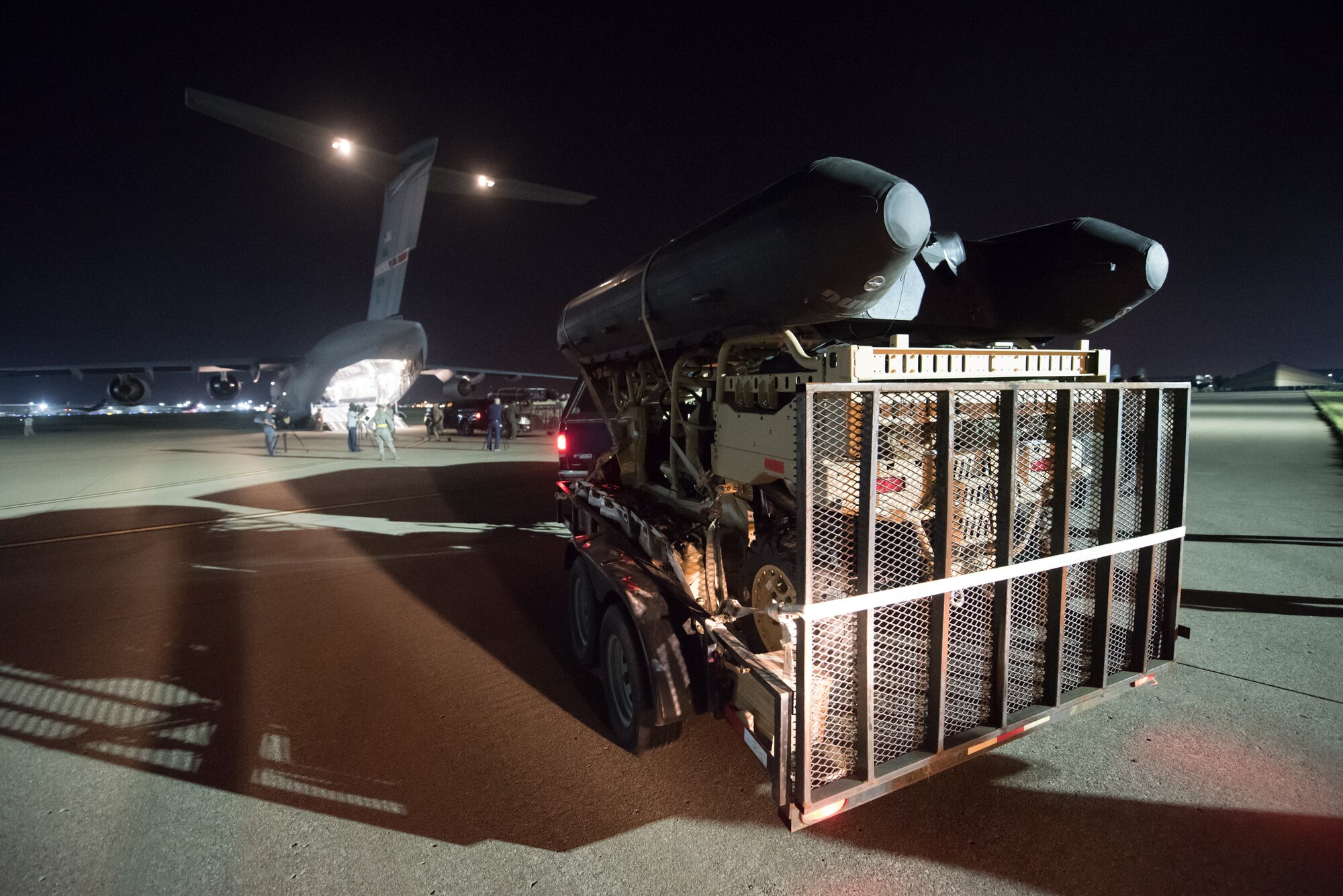 Airmen from the 123rd Airlift Wing load vehicles and cargo onto a C-17 Globemaster III aircraft at the Kentucky Air National Guard Base in Louisville, Ky., Sept. 15, 2018 in response to Tropical Storm Florence. The gear and 10 Airmen from the 123rd Special Tactics Squadron are being deployed to Naval Air Station Oceana in Virginia Beach, Va., to provide stand-alone communications, air traffic control, personnel recovery and paramedic capabilities in response to massive flooding.