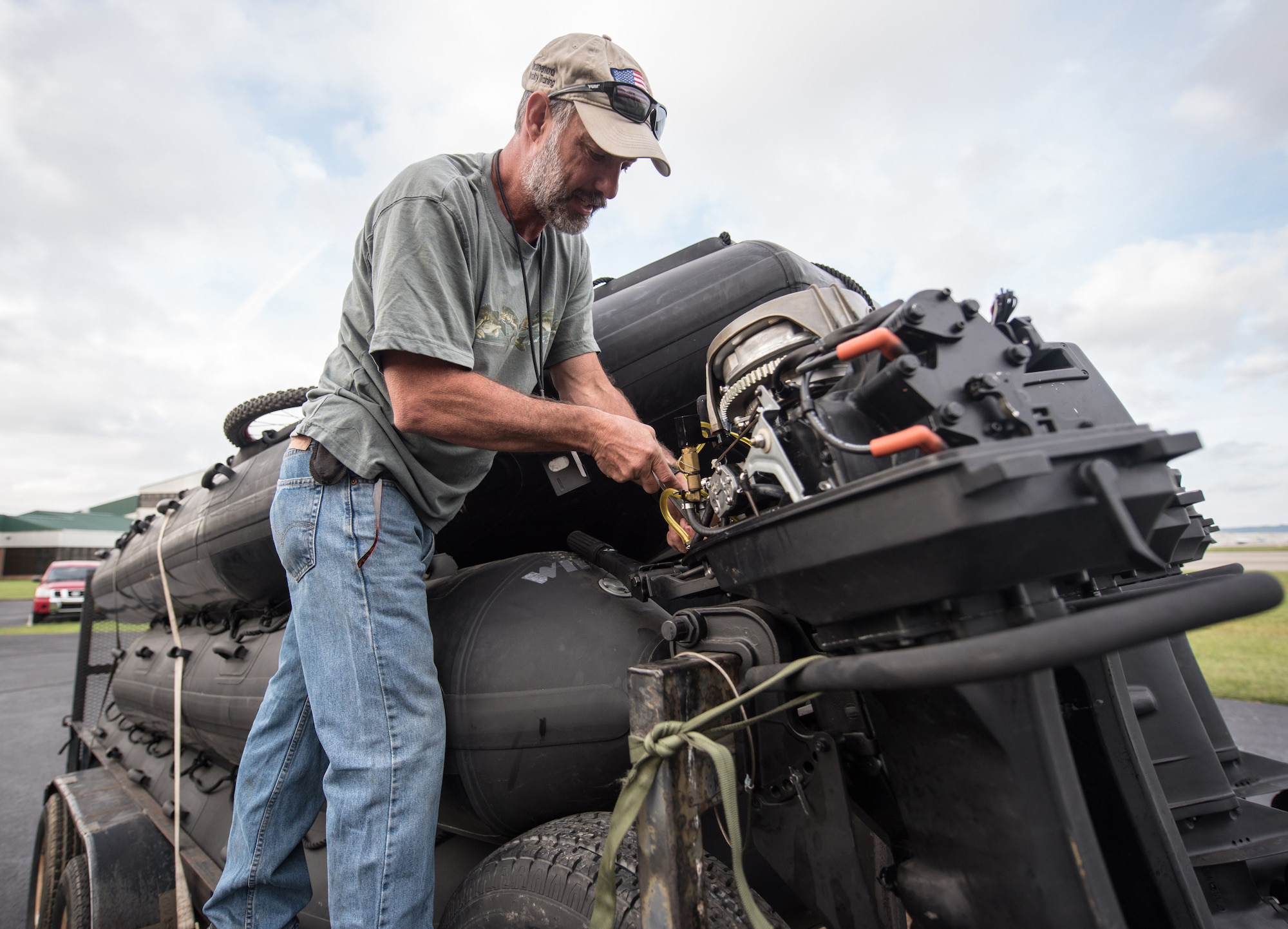 Gary King, a dive and maritime specialist assigned to the 123rd Special Tactics Squadron, works on the engine of a Zodiac boat at the Kentucky Air Guard Base in Louisville, Ky., Sept. 12, 2018.  The boats will be used by 123rd STS special operators who are deploying to the East Coast in response to Tropical Storm Florence.