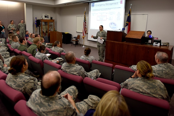 U.S. Air Force Master Sgt. Rebecca Tongen, 145th Airlift installation emergency manager, delivers a brief during a meeting held at the North Carolina Air National Guard (NCANG) Base, Charlotte Douglas International Airport, Sept. 14, 2018. Airmen across the base prepare for power outages that may occur as a result of Hurricane Florence. Master Sgt. Tongen and other individuals from the NCANG brief on safety, weather updates, and forecasted strategies in the wake of Hurricane Florence.