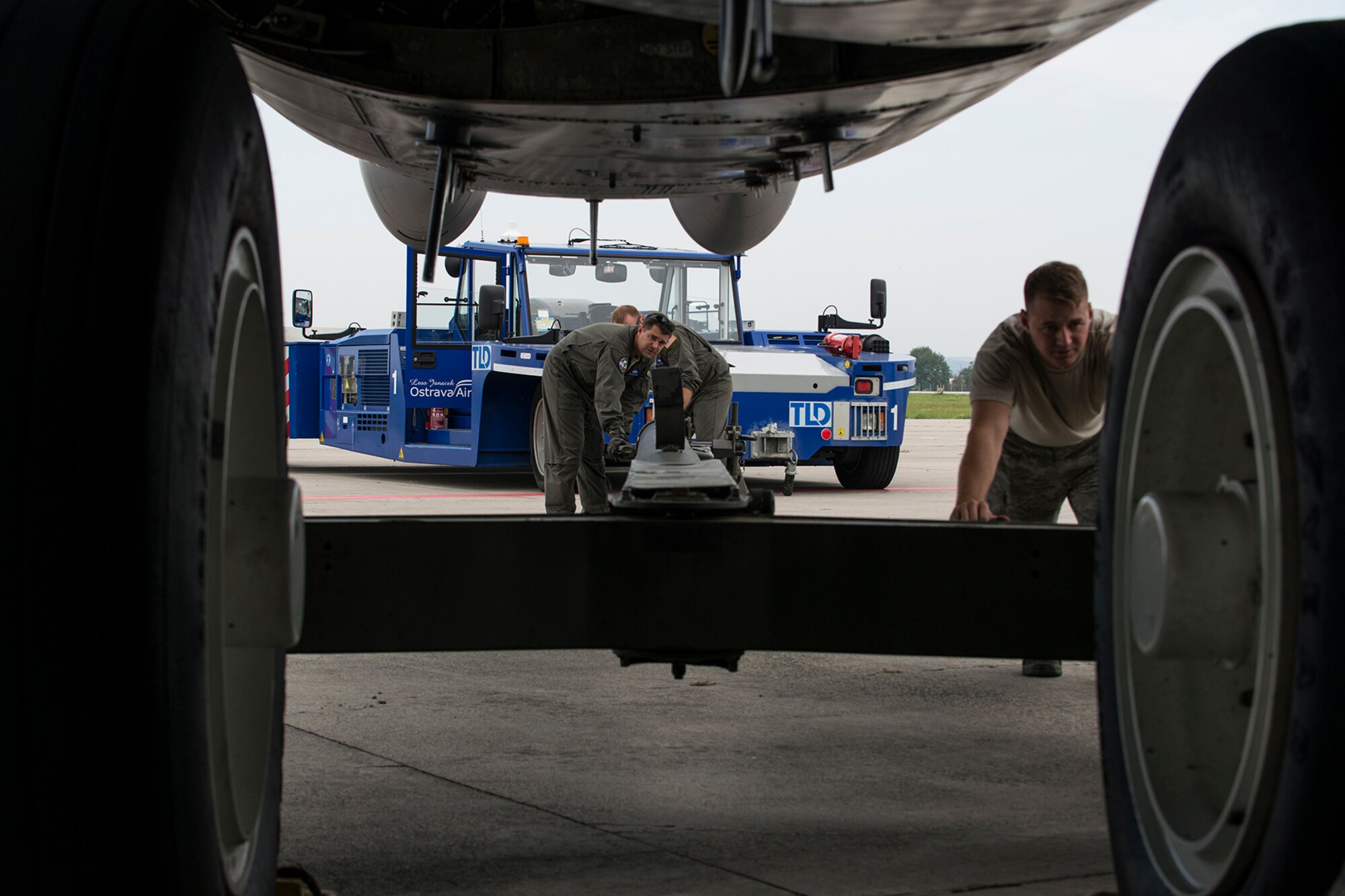 Airmen assigned to the Air Force Reserve Command’s 307th Bomb Wing, connect a tow bar to the front landing gear of a B-52H Stratofortress in preparation for towing on Sept. 13, 2018, Ostrava, Czech Republic. The Airmen and aircraft arrived in Ostrava in support of the NATO Days air show. (Master Sgt. Greg Steele)