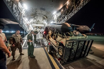 Airmen from the 123rd Airlift Wing load vehicles and cargo onto a C-17 Globemaster III aircraft at the Kentucky Air National Guard Base in Louisville, Ky., Sept. 15, 2018, in response to Tropical Storm Florence. The gear and 10 Airmen from the 123rd Special Tactics Squadron are being deployed to Naval Air Station Oceana in Virginia Beach, Va., to provide stand-alone communications, air traffic control, personnel recovery and paramedic capabilities in response to massive flooding.