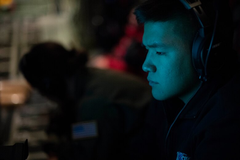 U.S. Navy Midshipman Suwen Jordan Sun helps read data for the Navy Airborne Expendable Bathythermographs deployed from the WC-130J Hercules during an Air Force Reserve Hurricane Hunter mission from the Air Dominance Center, Savannah, Ga., Sept. 12, 2018. The 53rd Weather Reconnaissance Squadron, or Hurricane Hunters, provides critical and timely weather data for the National Hurricane Center to assist in providing up-to-date and accurate information for storm forecasts. (U.S. Air Force photo by Tech. Sgt. Chris Hibben)