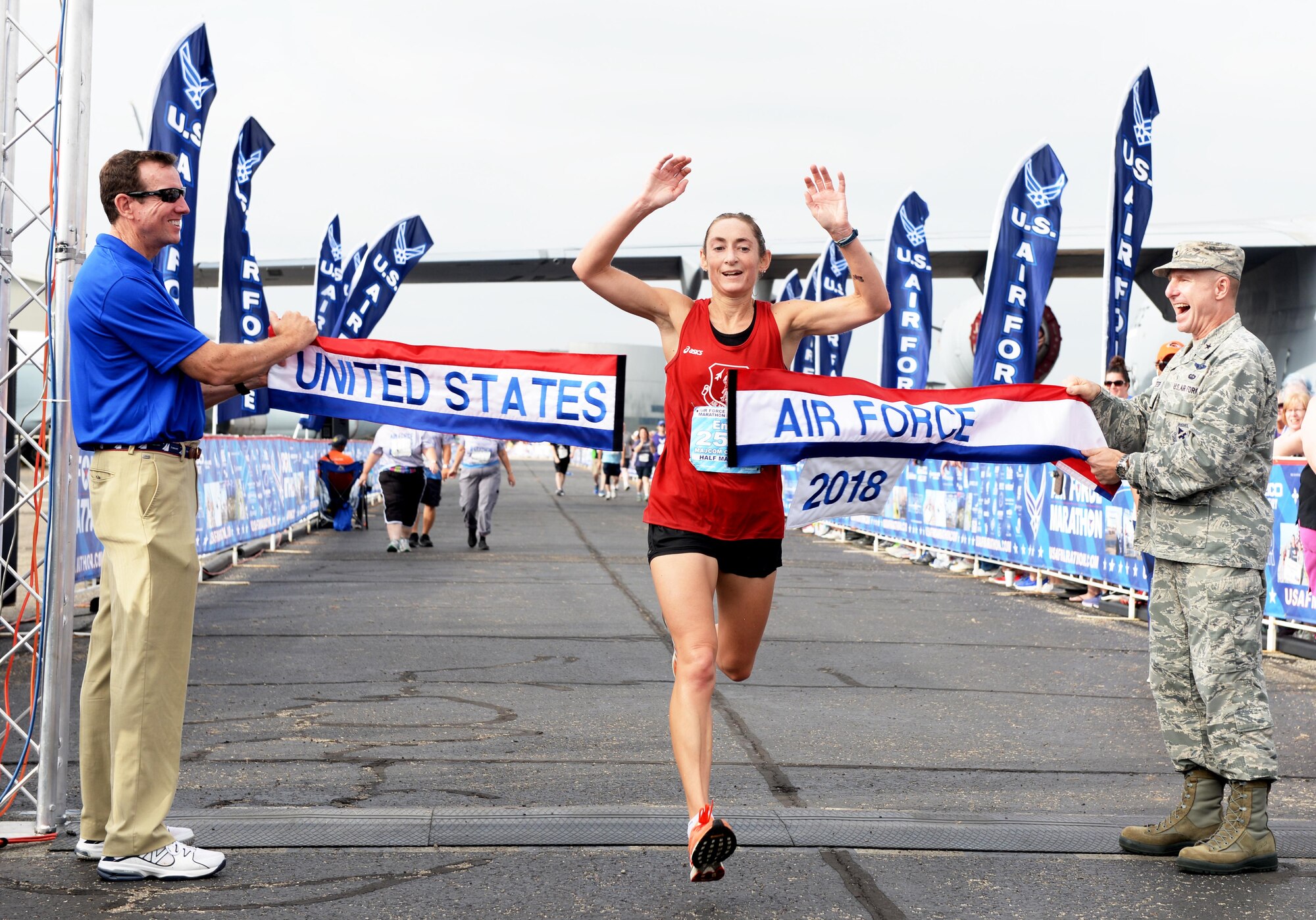 Emily Shertzer crosses the finish line of the Air Force Marathon half-marathon at Wright-Patterson Air Force Base on Sept. 15, 2018.  Shertzer, from Jonestown, Pennsylvania, won the women's division with a time of  1:23:27. (U.S. Air Force photo / Wesley Farnsworth)