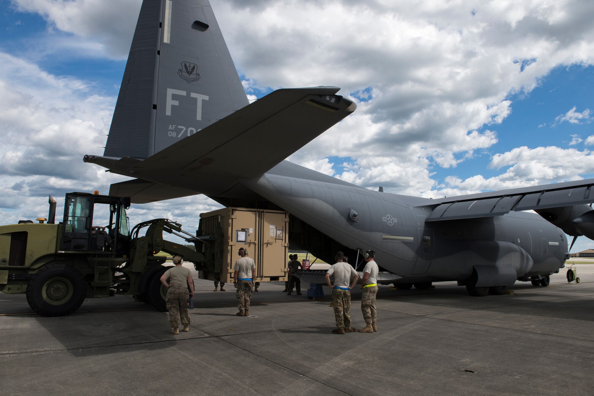 Airmen from the 71st Rescue Squadron and 723d Aircraft Maintenance Squadron load pallets and equipment onto a HC-130 J Combat King II, Sept. 15, 2018, at Moody Air Force Base, Ga. The 334th Air Expeditionary Group launched HC-130J Combat King IIs, HH-60G Pavehawks, aircrew and support personnel to pre-position at Joint Base Charleston, S.C., for potential Tropical Storm Florence response. Under the command of Col. John Creel, the 374th Rescue Group commander, the AEG integrated to make one expeditionary search and rescue unit comprised of rescue and support personnel from both the 23d Wing, 920th Rescue Wing at Patrick Air Force Base, Fla., and 51st Communications Squadron at Warner Robins Air Force Base, Ga.  (U.S. Air Force photo by Staff Sgt. Eric Summers Jr.)