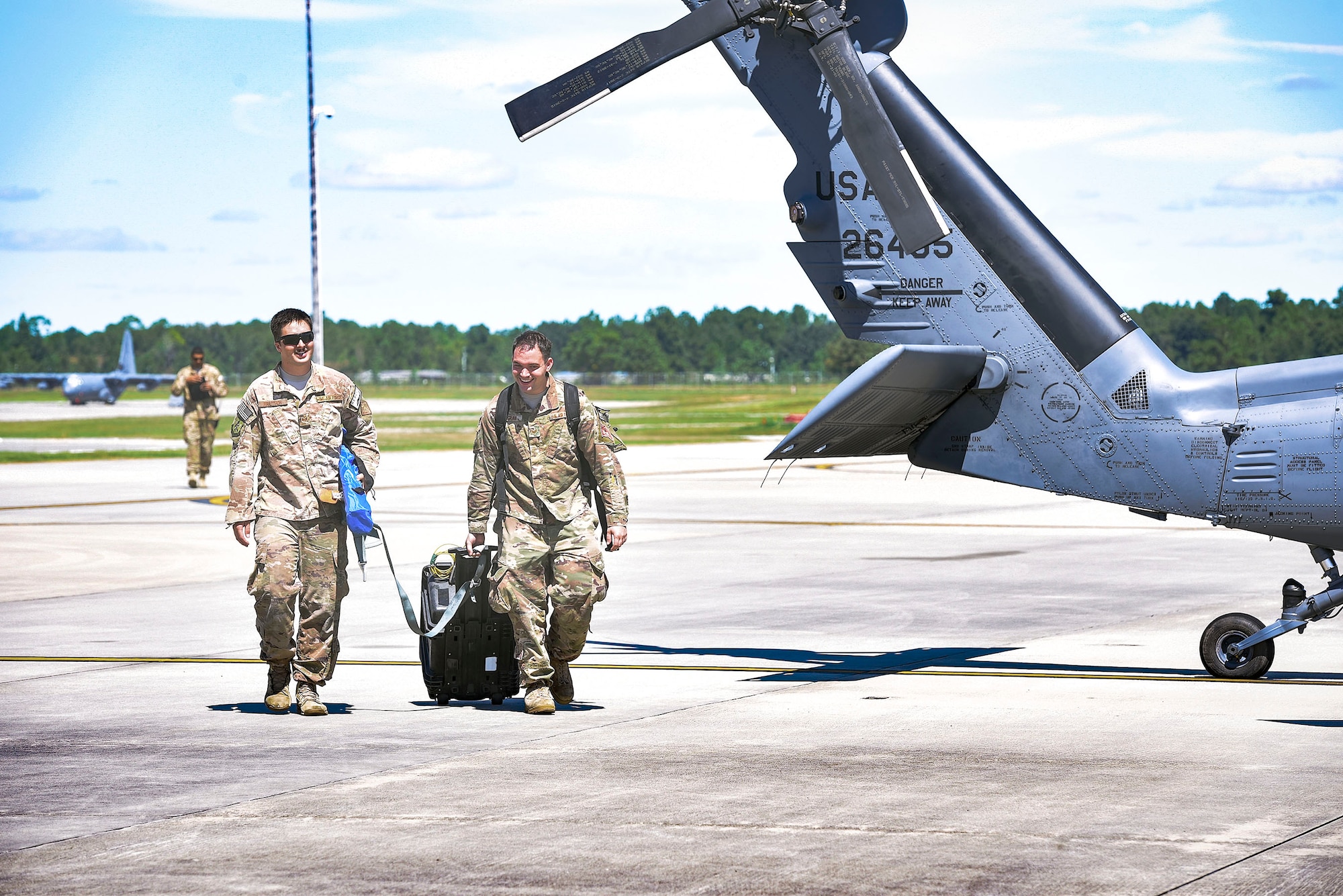 Airmen from the 41st Helicopter Maintenance Unit advance towards an HH-60G Pavehawk helicopter to perform maintenance, Sept. 15, 2018, at Moody Air Force Base, Ga. The 334th Air Expeditionary Group launched HC-130J Combat King IIs, HH-60G Pavehawks, aircrew and support personnel to pre-position at Joint Base Charleston, S.C., for potential Tropical Storm Florence response. Under the command of Col. John Creel, the 374th Rescue Group commander, the AEG integrated to make one expeditionary search and rescue unit comprised of rescue and support personnel from both the 23d Wing, 920th Rescue Wing at Patrick Air Force Base, Fla., and 51st Combat Communications Squadron at Robins Air Force Base, Ga. (U.S. Air Force photo by Senior Airman Greg Nash)