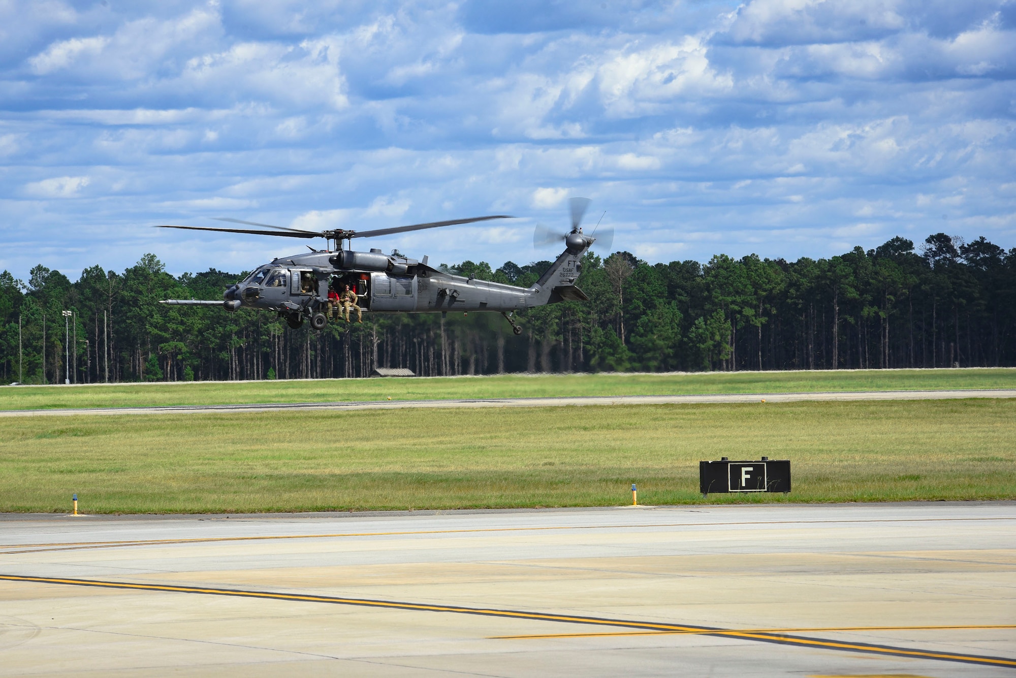An HH-60G Pavehawk helicopter launches in support of Tropical Storm Florence relief operations, Sept. 15, 2018, at Moody Air Force Base, Ga. The 334th Air Expeditionary Group launched HC-130J Combat King IIs, HH-60G Pavehawks, aircrew and support personnel to pre-position at Joint Base Charleston, S.C., for potential Tropical Storm Florence response. Under the command of Col. John Creel, the 374th Rescue Group commander, the AEG integrated to make one expeditionary search and rescue unit comprised of rescue and support personnel from both the 23d Wing, 920th Rescue Wing at Patrick Air Force Base, Fla., and 51st Combat Communications Squadron at Robins Air Force Base, Ga. (U.S. Air Force photo by Senior Airman Greg Nash)